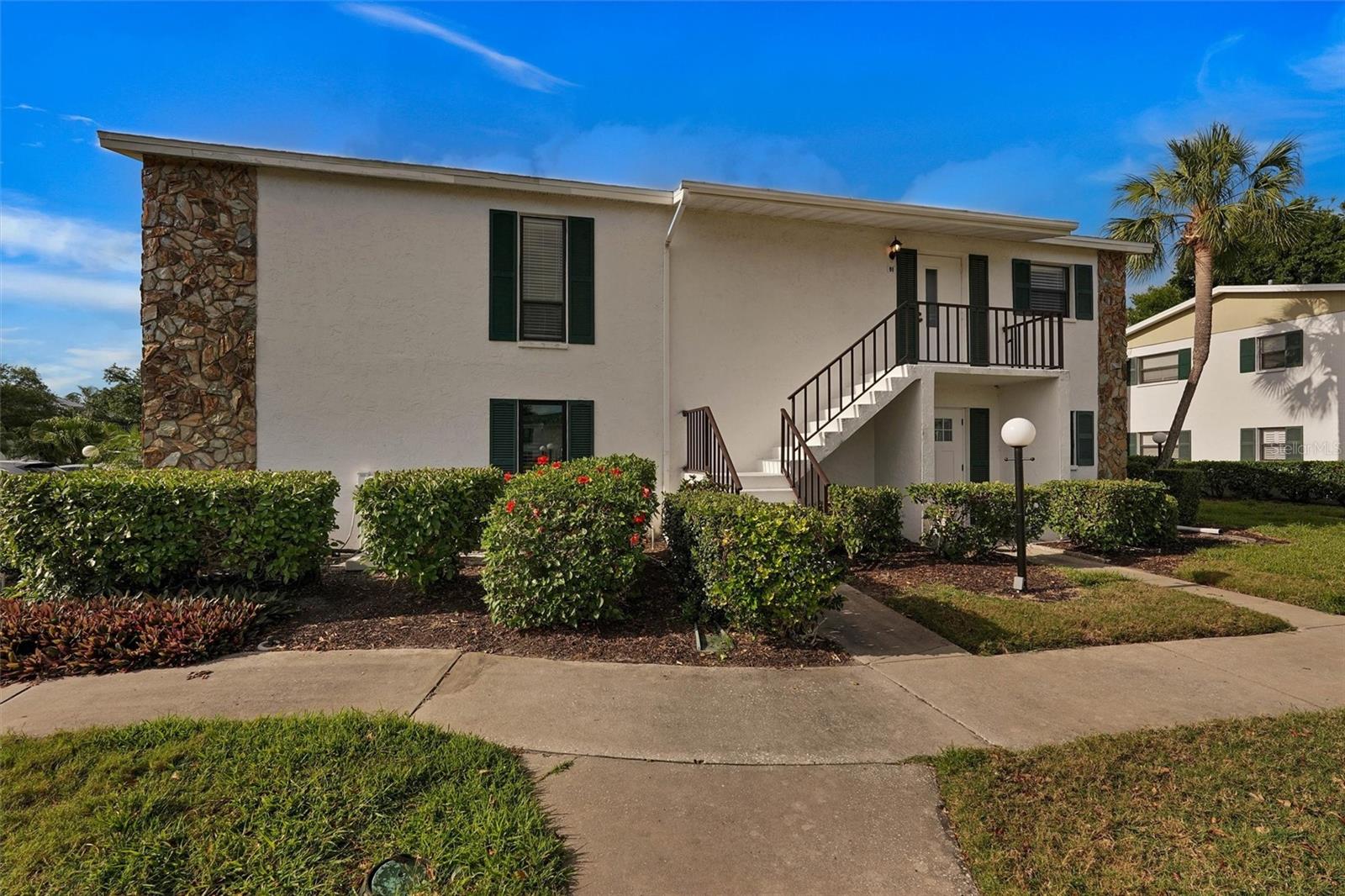 Welcome to the highly desirable 55+ community of Morton Village! This beautifully maintained, turnkey furnished 2-bedroom, 2-bathroom condo offers over 1,200 sq ft of comfortable, low-maintenance living with a bright, open floor plan and quality furnishings throughout.

Ideally positioned just steps from the community pool, this unit enjoys convenient access to all the amenities. The spacious layout is enhanced by tile and luxury vinyl flooring, providing both style and durability, while the open living and dining areas create a comfortable space for everyday living or entertaining.

A standout feature is the large enclosed balcony with newer windows, perfect for year-round enjoyment and additional living space. Plus, you'll appreciate the two additional storage closets, offering plenty of room for beach gear, seasonal items, and more.

The kitchen flows seamlessly into the main living space, and both bedrooms are generously sized with ample storage and natural light. With over 1,200 sq ft, there’s plenty of room to relax and host guests comfortably.

Whether you're looking for a full-time residence or a seasonal retreat, this move-in ready condo checks all the boxes. Enjoy the convenience of maintenance-free living in a friendly, active community located close to shopping, dining, and Gulf Coast beaches—just bring your suitcase and start enjoying the Florida lifestyle!