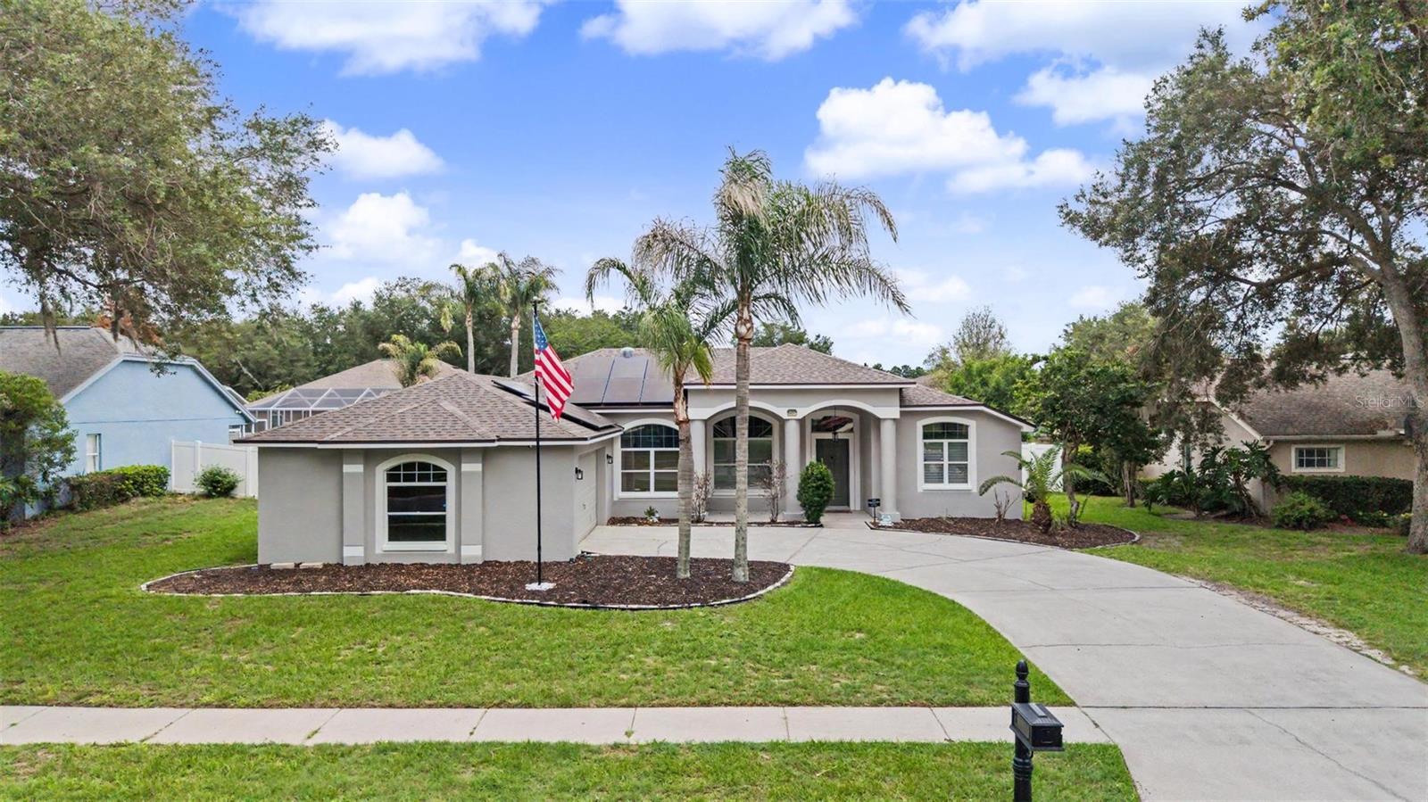 Welcome to Lithia Ridge of South Valrico. This beautiful 4 bedroom, 2 full bathroom home with a dedicated office boasts a fully fenced yard and a sparkling pool and spa. From the moment you arrive, the elegant curved driveway, attractive curb appeal, and spacious two-car garage with built-in storage cabinetry make a lasting impression. Major updates provide peace of mind, including a brand-new roof installed in March 2026 and fresh interior and exterior paint completed in May 2026. 19.6 kW solar system with 800Ah whole-home battery backup. Features 49 solar panels with Enphase microinverters and an EG4 hybrid inverter providing automatic backup power during outages. Batteries recharge from solar production, allowing extended self-sustaining operation without fuel, generators, or manual intervention. Significant utility savings and enhanced energy independence. Step inside to discover a bright, open floor plan with soaring ceilings and a desirable split-bedroom layout. A formal living room welcomes you at the entry, creating an inviting space for entertaining and special occasions and the private office features double glass French doors, offering the ideal work-from-home setup. The spacious kitchen is sure to impress with granite countertops, beautiful wood cabinetry, stainless steel appliances, and a separate eating area. The kitchen flows seamlessly into the cozy family room that showcases a view of the pool. The generously sized bedrooms provide plenty of living space, while the primary suite serves as a private retreat complete with walk-in closets and an ensuite bathroom featuring dual vanities, a soaking tub, and a glass-enclosed walk-in shower. A unique feature of the home is the rear full bathroom, which offers direct access from both the interior and the lanai, making it an ideal pool bath. Enjoy Florida living year-round from the screened lanai and sparkling saltwater pool and spa. The fully fenced backyard provides privacy and the extended paver patio, added in 2024 just outside the screen enclosure, offers even more room for outdoor entertaining, grilling, and relaxing. Located in the quiet and established Lithia Ridge community, this home is just minutes from abundant shopping, dining, and everyday conveniences. You’ll also have access to top-rated schools, making this exceptional property the complete package. Don't miss your opportunity to make it yours!