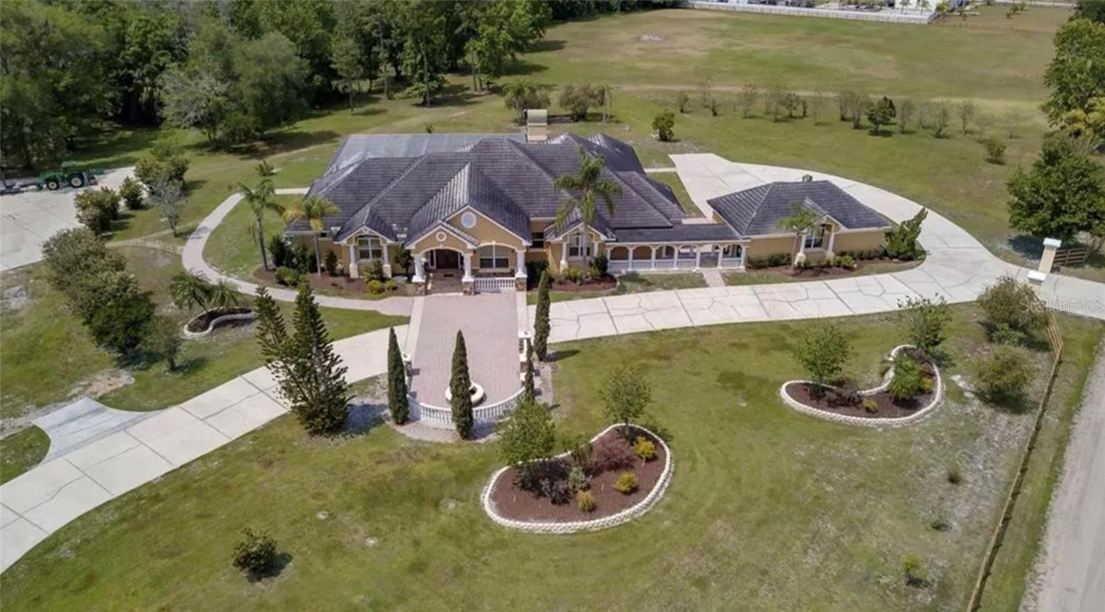 BACK TO MARKET! MUST SELL!
Palatial Estate on 35 Acres w/ Massive Warehouse & Development Approval! A once-in-a-lifetime offering! This is not just land; it's a magnificent 5-bedroom, 5.5-bathroom mansion situated on a massive 35 acre compound, complete with a commercial warehouse. Experience unparalleled luxury, privacy, and limitless potential. The Luxurious Residence: Boasting a commanding 5,044 sq ft under air, this home is designed for grand-scale living and entertaining. With 5 bedrooms and 5.5 bathrooms, it offers ample space for
family and guests. Modern Comfort & Style: While details are to be discovered, homes of this caliber often feature gourmet kitchens, expansive living areas, home theaters, game rooms, and resort-style pools—all possible in this incredible setting. Ultimate Privacy & Legacy Living: Enjoy the rare combination of a luxurious, move-in ready estate with the privacy and scale of your own 35-acre kingdom. The Income & Development. Assets: Colossal Commercial Warehouse (~8,000 sq ft): A business owner's dream. This clear-span facility with high ceilings, phase power is perfect for any enterprise, storage, or as a world-class private workshop. Generate significant income or pursue your passion project. Unrivaled Scale & Flexibility: With 35 acres, the options are endless. Keep it as a legendary private compound, develop a portion, or build a mixed-use legacy project. Short-term rentals are approved for future builds. Prime Location & No HOA: Total freedom just minutes from Disney, major highways, and all Kissimmee amenities. The property is paved, fenced, and has multiple access points.
This is more than a property; it's a legacy. A statement. A universe of possibilities. Contact us for a private showing of the estate and full
development portfolio. Confidentiality assured.
Currently use as Airbnb, all furnitures are included. Please schedule a showing with listing agent.