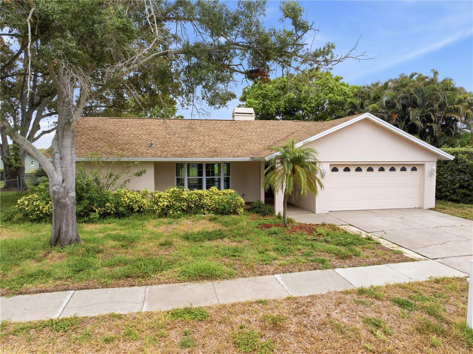 Welcome to this beautiful and inviting 3-bedroom, 2-bathroom home in the desirable Largo area, where comfort, style, and functionality come together to create the perfect place to call home. From the moment you enter, you’ll appreciate the spacious open-concept design, offering a seamless flow between the living, dining, and kitchen areas—ideal for everyday living and entertaining family and friends.
The heart of the home is the gorgeous kitchen, featuring elegant granite countertops, ample cabinetry, and a layout designed for both casual meals and memorable gatherings. The open living space is enhanced by a cozy fireplace, creating a warm and welcoming atmosphere for relaxing evenings at home.

The spacious primary suite offers a private bathroom featuring both a separate shower and relaxing bathtub, along with generous double vanity counter space for added convenience. 
Step outside and enjoy the peaceful back porch, perfect for morning coffee, outdoor dining, or unwinding after a long day while enjoying the Florida lifestyle. With its comfortable layout, charming features, and convenient Largo location close to shopping, dining, parks, and everyday amenities, this home offers the perfect blend of relaxation and convenience. Don’t miss the opportunity to make this wonderful property your own!