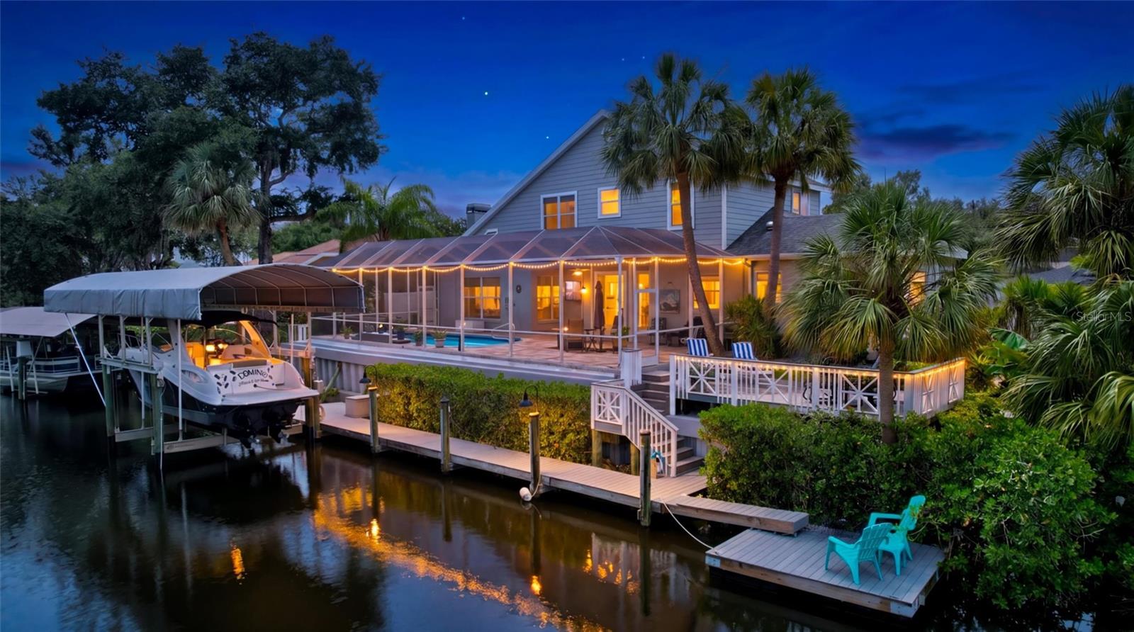 Welcome to this exceptional waterfront retreat located on a quiet cul-de-sac in Bradenton, offering 108 feet of deep-water saltwater canal frontage, direct boating access, no HOA, no CDD fees, and not in a flood zone. This beautifully maintained 4-bedroom, 2.5-bath home is designed for the ultimate Florida waterfront lifestyle and features a first-floor primary suite with a walk-in closet and ensuite bath with a walk-in shower, while upstairs offers three additional generous sized bedrooms and a full bath with a walk-in shower. The home features no carpet throughout, a spacious eat-in kitchen, formal dining room with wet bar, and an oversized two-car garage complete with epoxy flooring and a Tesla charger. Recent improvements include a 2020 roof, and in 2025, the heated saltwater pool underwent a renovation featuring a new pump, saltwater generator, heater, tile coping, premium Freestone pebble interior finish, and new paver decking, creating a resort-inspired setting for outdoor living and entertaining. Boating enthusiasts will appreciate the 2021 covered 16,000-pound boat lift, dock with floating dock, Trex deck sitting area, two reinforced concrete seawalls, and rip-rap shoreline protection. Enjoy fishing from your own dock, watching manatees and dolphins frolic in the canal, and take advantage of direct access to the Gulf of America just 6 nautical miles away. Outdoor living is enhanced by a spacious no-see-um screened lanai, multiple waterfront seating areas, and breathtaking sunset views enjoyed nearly every evening. Conveniently located just 2 miles from I-75, shopping, dining, medical facilities, and hospitals, this home is centrally positioned between Sarasota and St. Petersburg. Sarasota-Bradenton International Airport is approximately 25 minutes away, Tampa International Airport is about 50 minutes away, and the world-renowned beaches of Anna Maria Island are just a 25-minute drive from your doorstep, offering easy access to some of the most beautiful white-sand beaches on Florida's west coast. This exceptional property truly combines luxury waterfront living, outstanding boating access, abundant wildlife, spectacular sunsets, and unmatched convenience in one remarkable package.