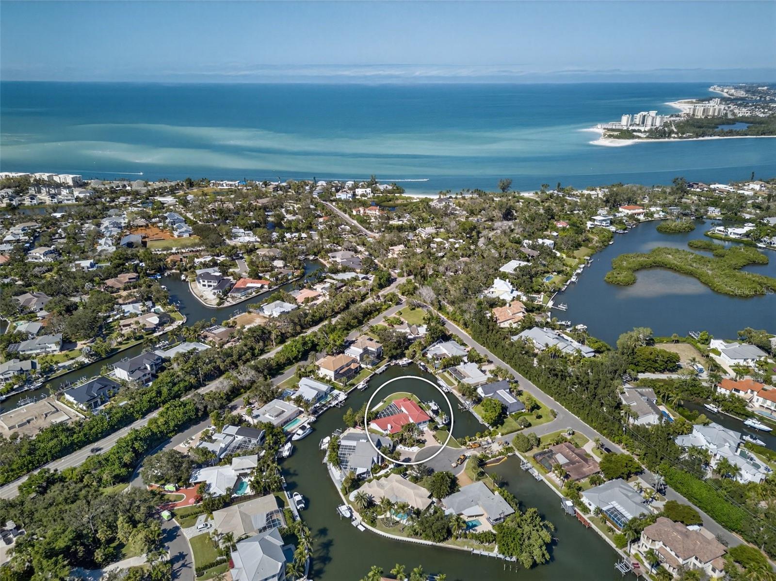Boater’s Dream on Siesta Key! Experience the ultimate waterfront lifestyle in this beautifully renovated Siesta Key home, offering an extraordinary 268 feet of waterfront and immediate access to the Intracoastal Waterway. No bridges to the bay. This is truly a boater’s paradise, complete with a private dock featuring two lifts, perfect for accommodating your vessels and exploring the surrounding waters, from a quick cruise to Skiers Island for water sports, to sunset sails on the Gulf of Mexico. Recently and thoughtfully renovated, this stunning coastal residence perfectly blends timeless design with modern luxury. Although originally built in 1970, because of the significant recent renovations, the effective year of this home per Sarasota County tax records is 2015. Boasting five spacious bedrooms, four and a half bathrooms, and 4,201 square feet of refined living space, it offers the ideal setting for relaxed everyday living and effortless entertaining. All within a home designed to complement today’s vibrant family lifestyle. Step inside to discover a light-filled, open floor plan framed by tranquil water views. New flooring and stylish fixtures create a crisp, inviting ambiance. The kitchen blends form and function with stainless steel appliances, custom cabinetry, quartz countertops, and a spacious island ideal for gathering with family and friends. The primary suite is a serene retreat featuring a spa-inspired bath and direct access to the pool terrace. Outdoor living shines with multiple spaces for lounging and dining beside the pool or enjoying the expansive waterfront lawn. Located on the north end of Siesta Key, just minutes off the island via the North Bridge and close to Siesta Key Village and the island’s world-famous white-sand beach. This property combines the best of island living and boating convenience, all in one exceptional address.