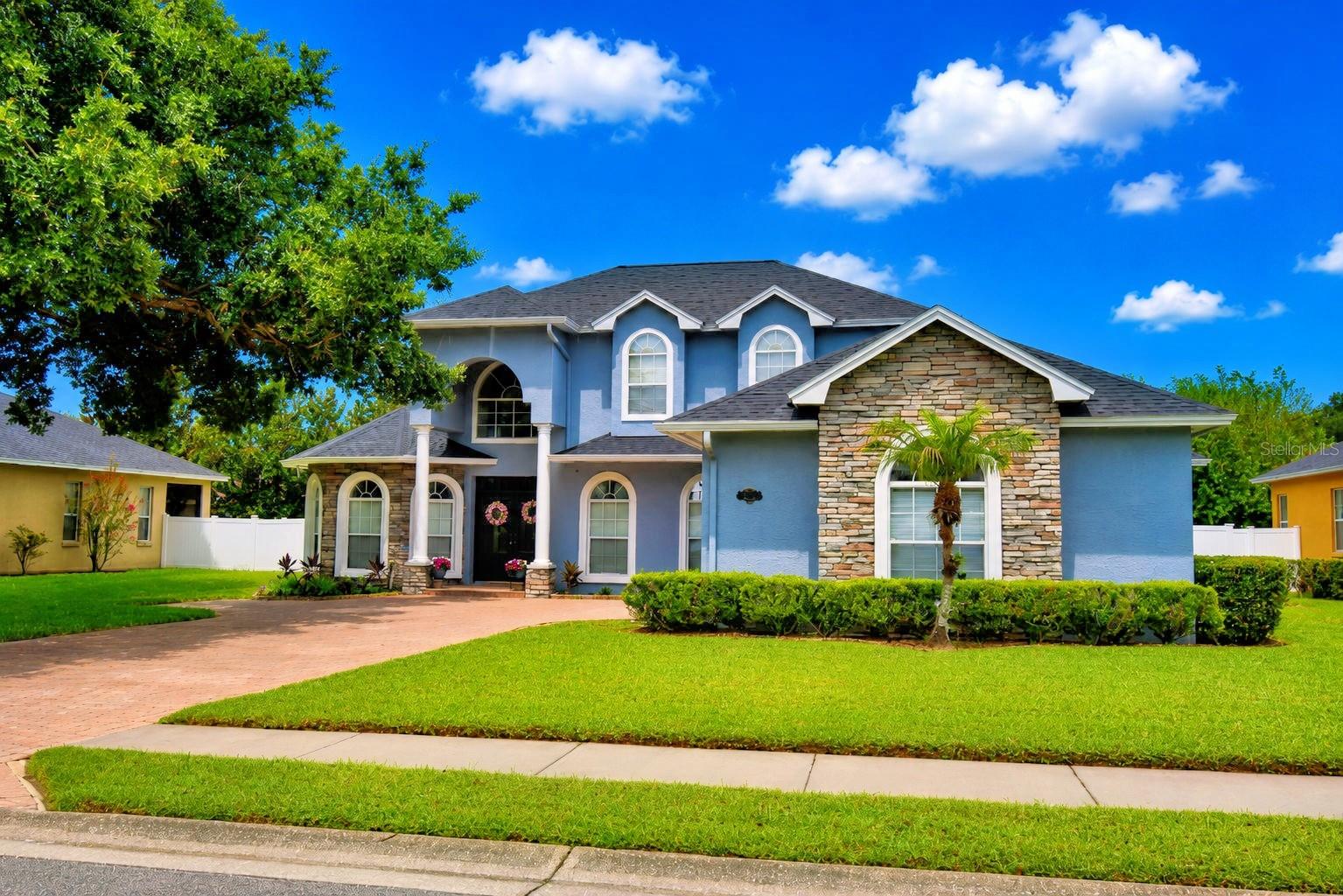 Welcome to this gorgeous executive pool home located in the desirable gated community of Hawks Ridge in North Lakeland. Offering 4 bedrooms, 3 full baths, a dedicated office, and an open, thoughtfully designed floor plan, this home is perfect for both everyday living and entertaining.
Step inside to soaring ceilings, abundant natural light, and extensive architectural moldings that showcase the home's quality craftsmanship throughout the first floor. Rich wood flooring in the office, formal dining room, and living room adds warmth and sophistication to the living spaces.
The first-floor primary suite is a private retreat designed for comfort and relaxation. Beautiful double doors provide direct access to the pool.  The luxurious ensuite bath features a relaxing garden tub, a large walk-in shower, dual vanities, a private water closet, and a generously sized walk-in closet, offering both comfort and functionality. Also on the main level is a dedicated office, along with a guest bedroom and a nearby full bath, making it an ideal setup for overnight guests or a private in-law suite.
The well-appointed kitchen is the heart of the home and features 42-inch wood cabinetry, Corian countertops, a tile backsplash, stainless steel appliances, a range hood, a breakfast bar, and a large center prep island. The adjoining breakfast nook is lined with windows overlooking the pool, while the formal dining room provides an elegant space for holidays and special occasions.
Upstairs, you'll find two additional bedrooms and a full bath, offering plenty of space for family or visitors.
Outside, the fenced backyard is designed for enjoying Florida living, complete with a sparkling pool and multiple seating areas for dining, entertaining, or simply unwinding in your own private setting.
The oversized 2-car garage offers plenty of room for vehicles and storage and even includes a third rear-facing garage door for convenient access to lawn equipment, tools, or recreational items.  Key updates include a new roof (2022), two newer A/C systems (2022 & 2023), and a new pool pump (2026), offering added value and peace of mind for years to come.
This move-in-ready home is conveniently located near shopping, restaurants, medical facilities, and entertainment, offering the perfect combination of luxury, comfort, and convenience.