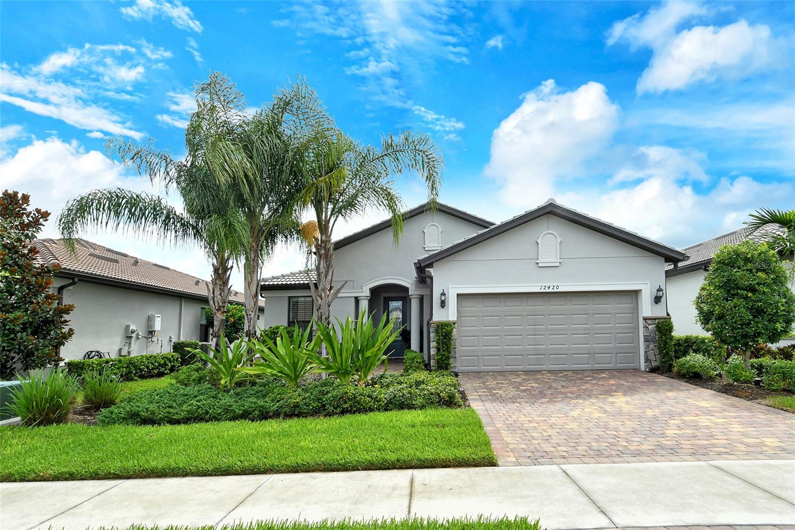 Model perfect maintenance free Martin Ray floor plan in popular Hammock Preserve. This is the one you have been waiting for. 3 bedrooms plus an office/den with built-ins & 2 baths. Upgraded white washed wood look tile throughout entire home (no carpet). Hurricane impact windows & sliders. Outdoor kitchen with refrigerator, sink & hood, heated salt water pool & spa with lake views on paver brick lanai. 3rd bedroom with built in Murphy Bed. Whole house generator. Extended garage for additional storage. Upgrades to please the most discriminating buyers. Motorized window treatments in great room. Wet bar with refrigerator. Master bedroom has tub & shower.  Chef's kitchen with white cabinets, white quartz & stainless high end appliances for a modern look. Hammock Preserve is a resort style maintenance free community. The maintenance fee covers all landscaping, maintenance of the irrigation system & access to resort amenities including clubhouse with activity director, heated Olympic pool, jacuzzi, fire pit, fitness, tennis, pickle ball* Located on popular Palmer Ranch just minutes from shopping & beautiful Siesta Key Beach*