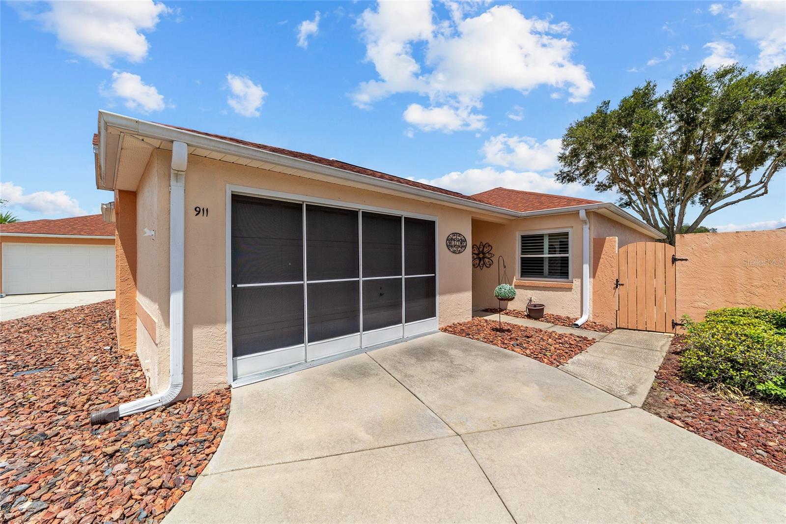 NO BOND! TURNKEY! Welcome to this bright, cheerful, and low-maintenance 2-bedroom, 2-bath Baja Villa, ideally located in the desirable Hacienda Villas in the Village of Del Mar...Just WALKING DISTANCE from SPANISH SPRINGS...This cozy home offers comfortable Florida living with luxury VINYL PLANK FLOORING throughout the main living areas and both bedrooms, complemented by tile flooring in both bathrooms. Enjoy peace of mind with UPGRADED WINDOWS (EXCEPT the GARAGE WINDOW) and the SLIDING GLASS DOOR, replaced in 2023.
The spacious PRIMARY BEDROOM with EN-SUITE BATHROOM and a generous WALK-IN CLOSET. The GUEST BEDROOM is also comfortably sized with its own closet and is conveniently located just steps from the guest bathroom. A door separates the guest bedroom and bath from the main living area, creating a private guest wing that functions like a second en-suite—ideal for overnight guests.
charming DECORATIVE FIREPLACE, that creates a warm and relaxing focal point while adding to the home’s bright, cheerful ambiance.
Additional upgrades include elegant PLANTATION SHUTTERS (2023), EXTERIOR PAINT (2022), REPLACED ROOF (2025) ,a REPLACED HOT WATER HEATER (2025), and a protective surface applied to the garage floor for a clean, finished appearance. The garage also features a screen door, allowing you to enjoy fresh air while adding versatility to the space.
To add to this home’s appeal, the OVERSIZED PRIVATE BACKYARD offers exceptional outdoor living space with the potential to accommodate a pool. The spacious yard wraps around the side of the home, providing ample room for a grill, outdoor dining, and entertaining family and friends.
Conveniently located near shopping, restaurants, recreation centers, swimming pools, golf courses, and The Villages popular nightly entertainment, this home truly offers the ideal Florida lifestyle. Schedule your private showing today!