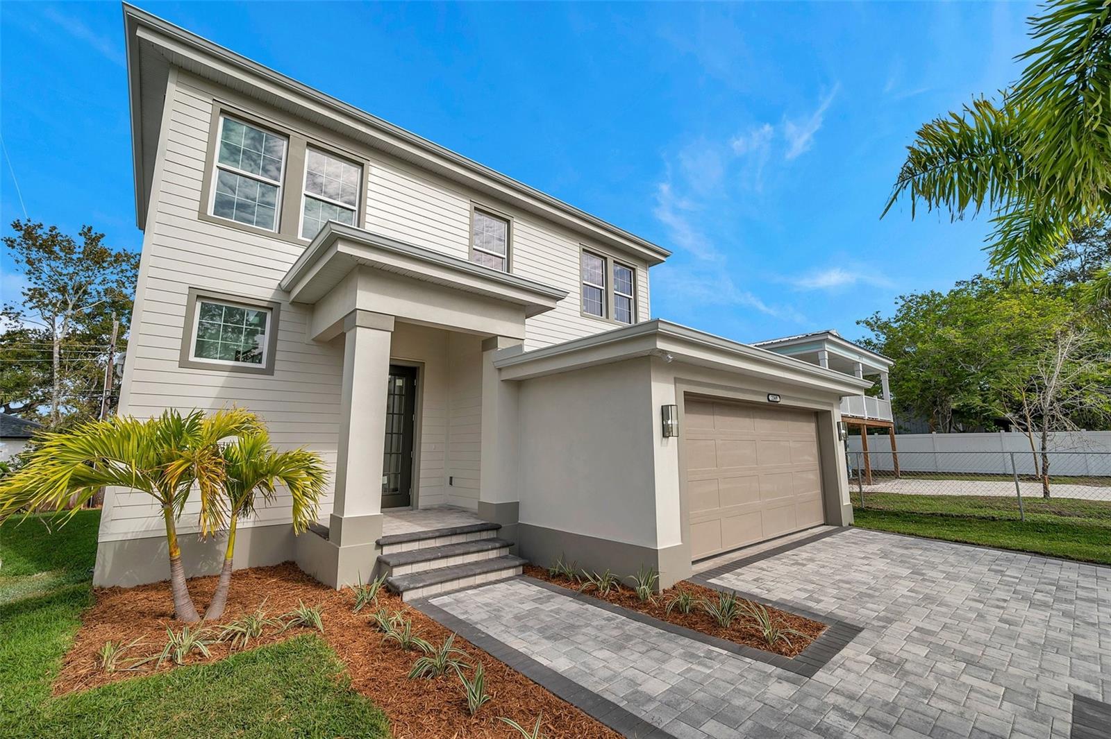 Discover the ultimate in luxury living just a short drive from downtown Sarasota, St. Armands Circle, and Lido Beach! Designed by Arrow Homes, this inviting custom-built 2 story residence offers  4 bedrooms and 21/2 baths. Don’t miss the elegant traditional design and exceptional craftsmanship. Enjoy impressive 9’-4” ceilings,  spacious owners suite, bonus loft area,  custom PGT Florida Impact Rated windows and doors, oversized 2 car garage, and  immaculate wood flooring and beautiful crown molding throughout the home.  The open airy gourmet kitchen boasts wood cabinetry,  complete with an entertainer’s island, and  elegant quartz countertops highlighting the custom feel.  The spacious first floor owners suite is an oasis of calm with tray ceiling, crown molding, walk in closet  and a custom attached bath featuring a glass enclosed shower and freestanding soaking tub. Upstairs is the loft area along with 3 additional bedrooms and a full bath.  The loft area offers desirable extra space for an office, sitting room, or kids TV area.  Outside the oversized raised lanai invites you to fully enjoy the Florida way of life with plenty of room for an outdoor kitchen, hot tub, and more!  The exterior of the home offers a private backyard beautifully designed landscaping, St Augustine grass,  a dedicated irrigation meter and system, and a paver drive and walkway. This fantastic location is in the Southside school district with quick access to high-end shopping, dining, and entertainment opportunities.  There is also room for a pool should you wish to add to the property. LOCATION, LOCATION, LOCATION! Perfectly situated to enjoy all that Sarasota has to offer. You are just minutes from the vibrant energy of Downtown Sarasota, the exclusive shopping and dining of St. Armands Circle, and the iconic shores of Lido Beach. Enjoy a short drive to world-famous Siesta Beach and the charm of Pinecraft. Exceptional proximity to top-tier medical facilities, being only half a mile to Sarasota Memorial Hospital PLUS the interstate all within 3-5 miles or just steps to public transportation. This is the exceptional lifestyle and quality home you have been waiting for!