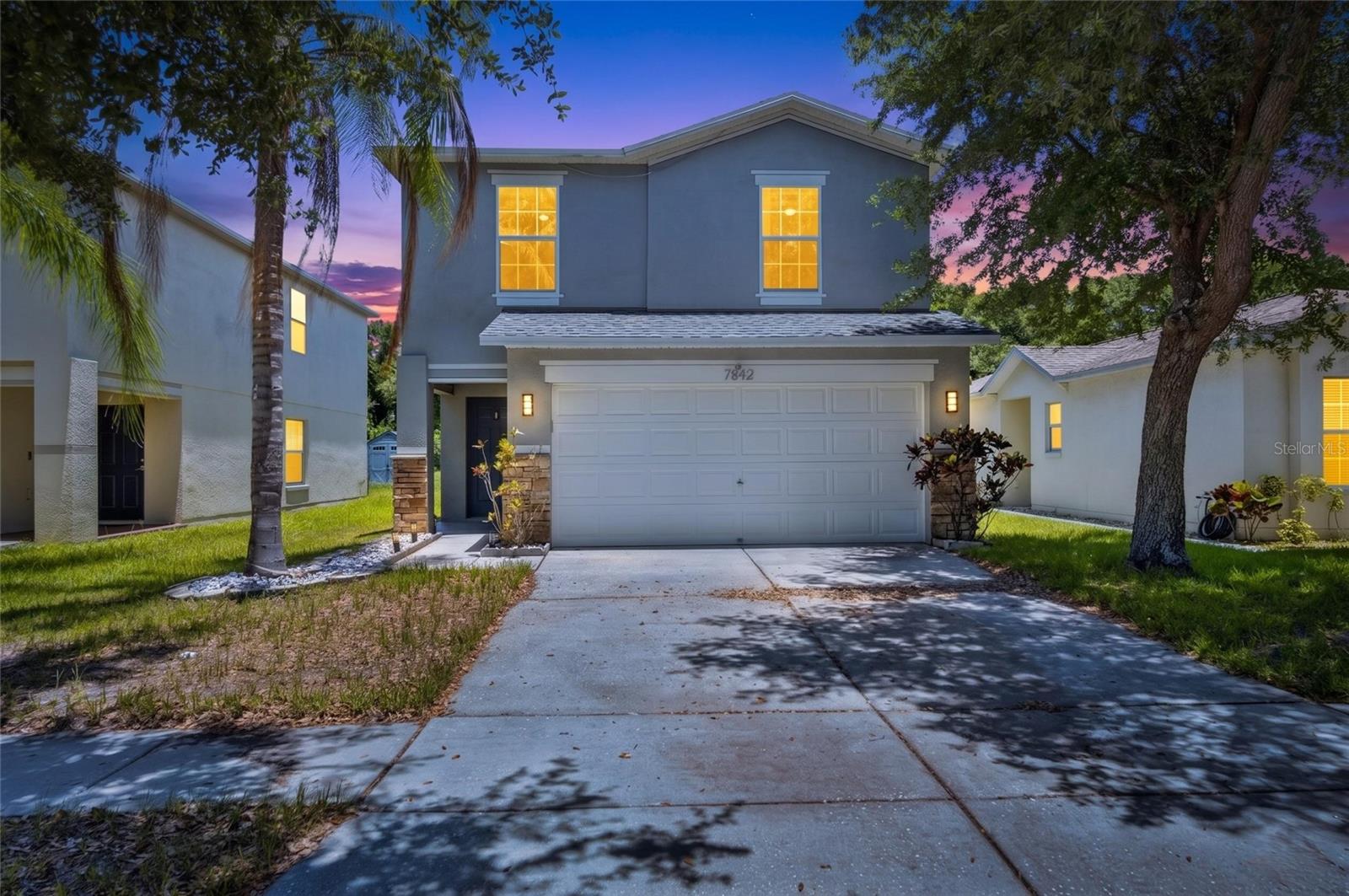 Short Sale. Welcome to 7842 Carriage Pointe Drive, a beautifully updated two-story home located in the highly desirable Carriage Pointe community of Gibsonton, where modern upgrades, functional living spaces, and an assumable mortgage opportunity come together to create an exceptional place to call home. Offering 4 bedrooms, 2.5 bathrooms, and over 2,050 square feet of thoughtfully designed living space, this residence welcomes you with soaring ceilings, abundant natural light, and an open-concept layout enhanced by luxury vinyl plank flooring installed in 2022. The stylish kitchen serves as the heart of the home and features shaker-style cabinetry, granite countertops, stainless steel appliances, and a spacious center island perfect for entertaining, meal preparation, or casual dining. The main level also includes a generous family room and a versatile flex space that can easily function as a home office, playroom, or additional living area. Upstairs, all four bedrooms are privately situated, including a spacious primary suite complete with a custom accent wall and a spa-inspired en-suite bathroom designed for relaxation. Major updates provide added peace of mind, including a new roof and air conditioning system installed in 2022, as well as a new water heater in 2023. The home is equipped with leased solar panels with an assumable lease, offering the potential for improved energy efficiency and lower monthly utility costs. Step outside to your fully fenced backyard retreat, where peaceful conservation views provide the perfect backdrop for relaxing evenings, outdoor gatherings, and everyday enjoyment. Residents of Carriage Pointe enjoy access to an impressive collection of community amenities, including a resort-style swimming pool, fitness center, tennis courts, basketball courts, and a clubhouse with a party room, all while being conveniently located near I-75 with easy access to shopping, dining, entertainment, and everything the Tampa Bay area has to offer. Virtual Tour Link: https://iplayerhd.com/player/video/47c0c6bf-a95f-45fa-8132-6e39de378698