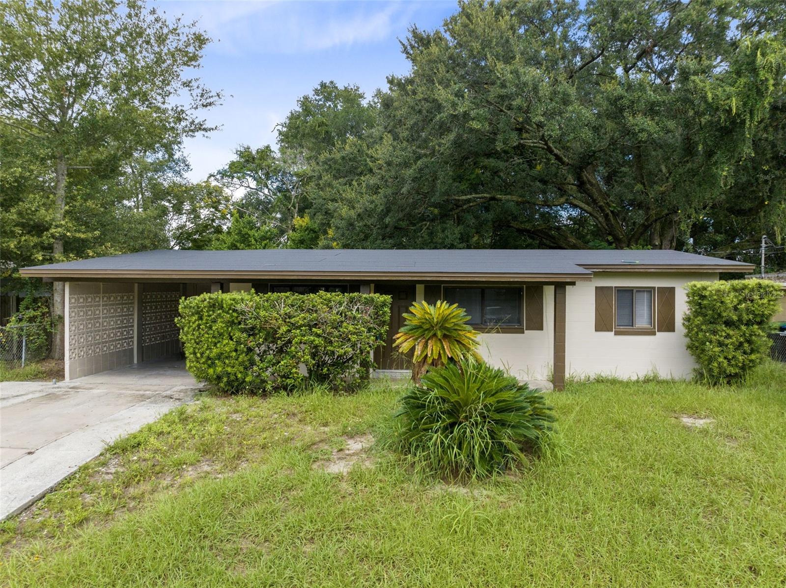 This charming fully remodeled 3 bedroom, 1 bath, 888 sqft single family home is conveniently located in the Barbara Terrace neighborhood. As you walk in, you will find a spacious living room with beautiful built-in shelving. Walking further, you will walk right into the dining room that is connected to the kitchen to the right. The kitchen features modern white wooden cabinets (FRESHLY PAINTED), a stunning light ceramic tile backsplash (NEW), & refinished kitchen counters. To the right of the living room is a hallway that leads to the 3 bedrooms and the bathroom. 
Throughout the entire home, you will find NEW stunning vinyl plank flooring in a modern grey-tone as a great access to the white walls, which make the home look very bright.
The home comes with more MAJOR UPGRADES (9/2023): NEW EXTERIOR PAINT & Ceiling Paint, several NEW windows throughout the home, refinished bathtub, NEW Ceiling Fans & Light Fixtures, NEW Blinds, etc.
Further, the home has a carport with a second door to the home. In addition, there is an outside laundry room. In the back of the home is large yard space to host family and friends and a small shed to store tools. The yard can be accessed from the outside, but also through a door in the kitchen. In the front of the home is a nicely long-stretched covered porch to enjoy your morning cup of coffee. 
Located in close proximity to US-441 with direct connections to major highways, you can EASILY ACCESS EAST and WEST Orlando and all it has to offer. 
You will surely LOVE to call this place home!