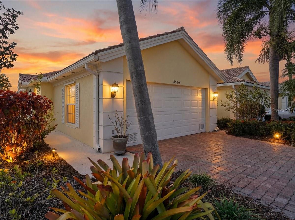 MAJOR PRICE REDUCTION! Recent price improvement positions this tastefully updated home competitively with less-updated recent sales in the community. The seller has authorized a substantial price adjustment and is considering alternative plans for the property should it not sell.

Live the Florida lifestyle in this tastefully RENOVATED two-bedroom, two-bath villa in Sarasota’s sought-after Village Walk community. This home has the OPTIONAL EXTENDED LIVING ROOM with a larger open living area. Much more desirable in contrast to the smaller standard size offered in this model according to long time residents. the vaulted ceilings and an open layout highlight the RENOVATED KITCHEN APPLIANCES and CERAMIC PLANK-STYLE FLOORING throughout the main living areas.

Both bedrooms feature en-suite baths and WALK-IN CLOSETS. The BATHROOMS HAVE BEEN UPDATED, The primary bathroom has ALL-NEW CERAMIC TILE, COUNTERTOPS, CABINETRY, SINKS, SHOWER AND FIXTURES, while plush carpeting adds comfort to both bedrooms.

Enjoy peaceful lake views from the EXPANDED AND RENOVATED LANAI, featuring PAVER FLOORING, A LARGE SCREENED ENCLOSURE, AND A REMOTE-CONTROL POWER CANOPY FOR ADDED SHADE—perfect for year-round outdoor living. Additional highlights include an interior utility room and a TWO-CAR GARAGE WITH A DURABLE, STAIN-RESISTANT FLOOR FINISH.

Village Walk has a very active gated community with an event planning staff and offers high-end, resort-style amenities including extra large pools, modern complete fitness center, multiple tennis and pickleball courts, scenic walking paths, and on-site conveniences, stores, restaurants, a tiki hut bar and gas station. Ideally located in Palmer Ranch, just minutes from shopping, dining, the Legacy Trail, and Siesta Key beaches.