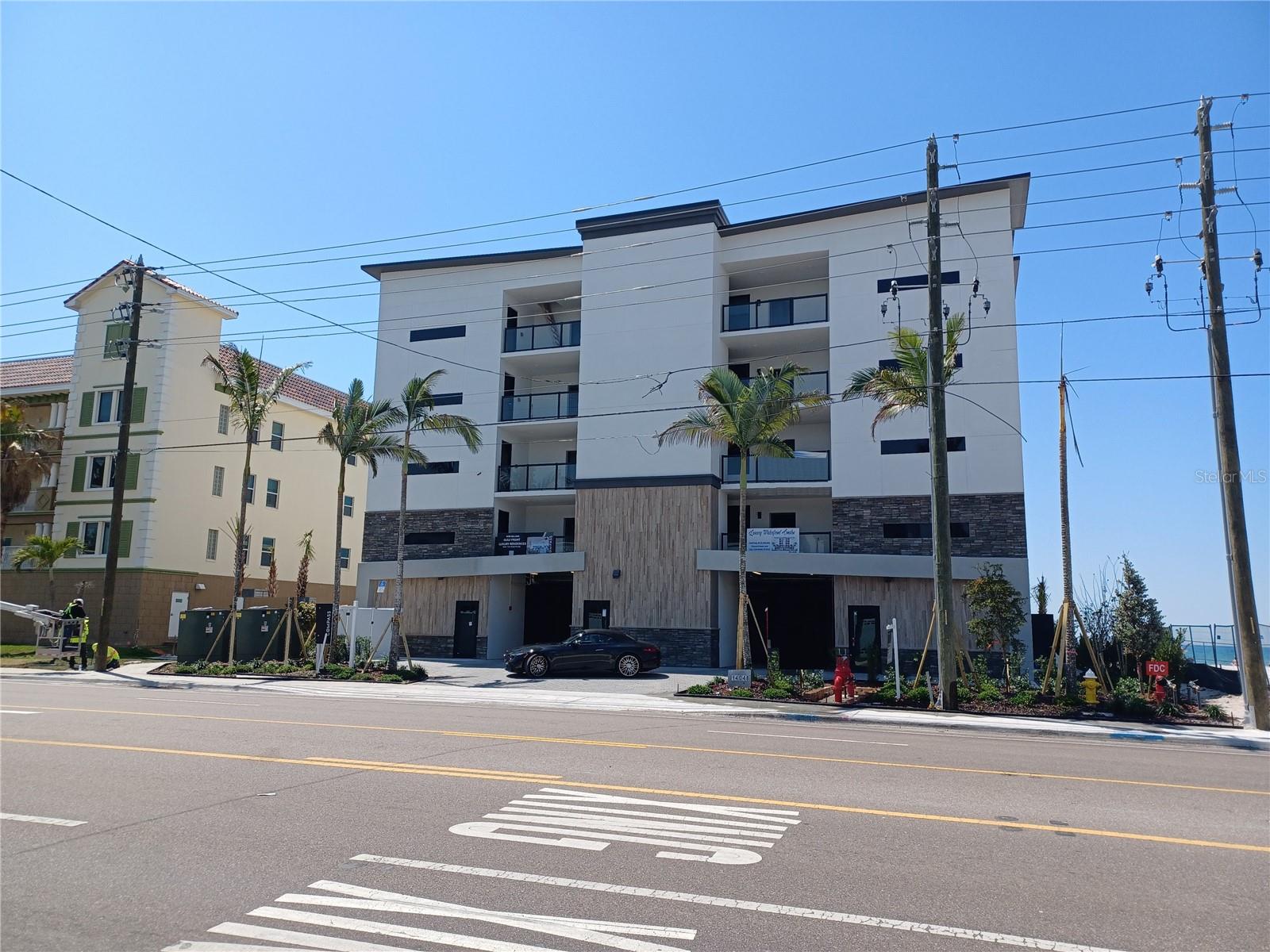 GULF FRONT - Spectacular new building on Madeira Beach. Each unit offers high-end features, an expansive outdoor living area, and direct Gulf views with incredible sunsets. Units starting at $2,625,000. This exquisitely designed building will only have 8 units - 2 units per floor, offering an elevator, pool/spa and under building parking. This unit has 2 bedrooms, 3 baths plus a den. Stainless steel appliances, designer backsplash, high-end cabinetry package for kitchen and bathrooms, solid core doors and premium hardware. Engineered wood flooring with sound mat underlay, luxury carpet in 2nd bedroom and den. Large format tile in Master En-Suite, complete with art-deco accent behind the vanity and custom shower floor design. The second & third bathrooms will include luxury details with tub surround and 6” mosaic tile waterfall accent. Hurricane impact windows and sliders. Large covered outdoor living space (991 sq. ft) will include built-in features and porcelain tile. Beachfront pool and spa with large deck, paver parking lot, landscape package with irrigation system, and exterior  lighting. Condo docs available. HOA costs, requirements, leasing, etc to be determined.