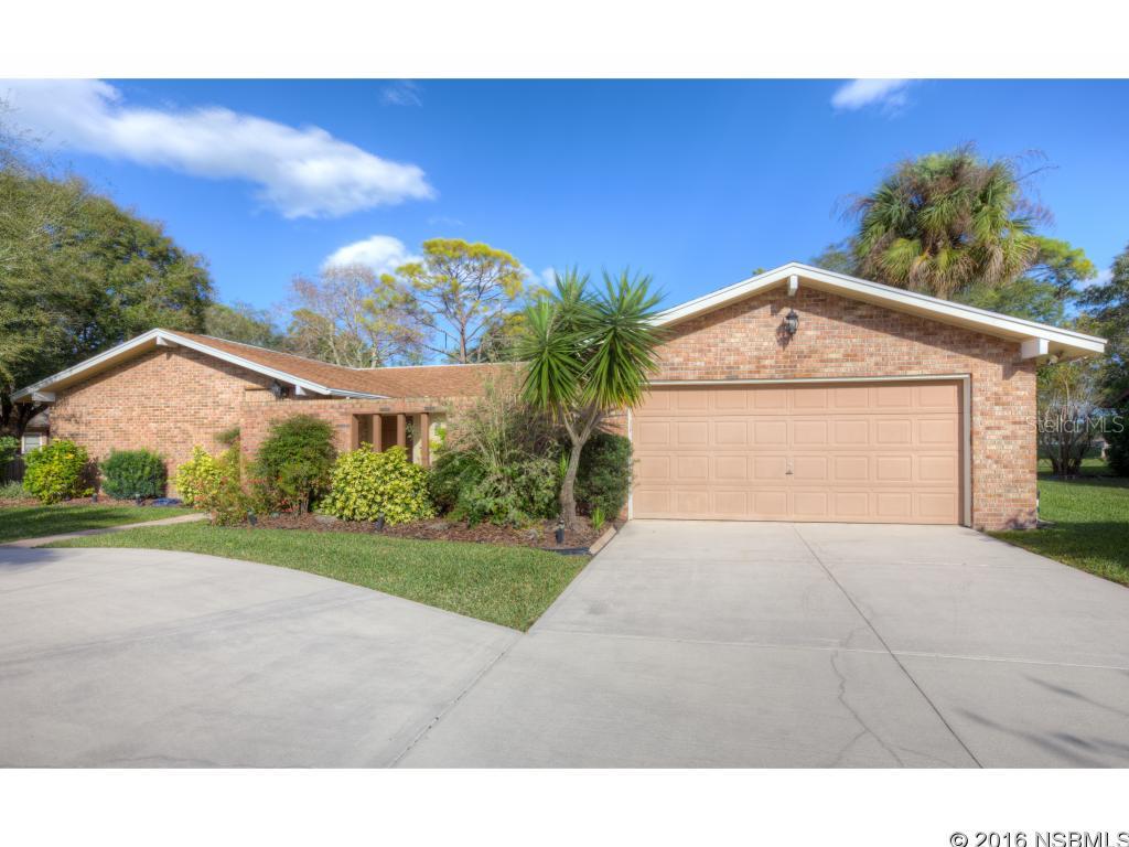 Enjoy GOLF COMMUNITY living without the extra expense of association fees.  Directly on the municipal golf course, this spacious 3 bedroom 2 bath home was designed with a lot of living and entertainment space with an open split bedroom floor plans. The kitchen is HUGE and features a bay window overlooking the green from the eat-in breakfast nook, breakfast bar, walk-in pantry, and a lot of cabinet and counter space. There is also a serving window between the kitchen and built in bar in the living room.  Other highlights include skylights, 2 newer AC & Heat units, expansive pantry, yard irrigation and sprinkler system and a private bridge to the golf course.  If golf doesnât interest you, relax on the cozy private front paver patio courtyard complete with fire pit and waterfalls.  This home is ideal for relaxing, entertaining, and living the ultimate Florida lifestyle. ;Water: City
