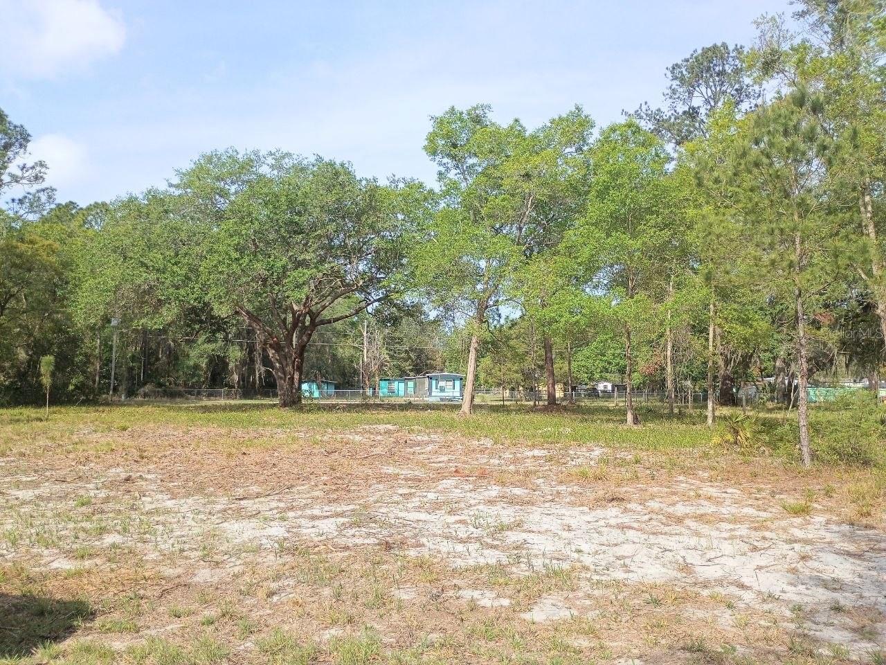 Come look at this extraordinary almost an acre of land located in Fort McCoy. Land has been cleared and its ready for a new home. R4 parcel which should be approved for mobile homes or site build homes. Land has access thru Ne 141st ct and Ne 141st Ave. Electricity nearby, will require well and septic.