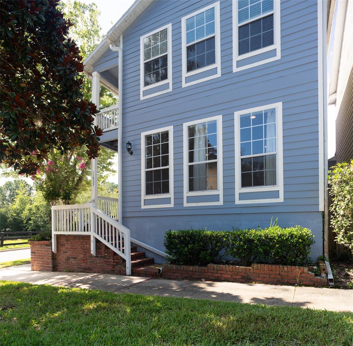 Welcome to Charleston Park at Fletcher’s Mill. This 2-story corner-lot home features 3 bedrooms, 2.5 baths, a downstairs master suite with walk-in closet, an eat-in kitchen, and traditional split dining & living rooms with wood floors and tile. The living area also boasts a beautifully maintained fireplace in the living room, stainless steel appliances and granite counters in the kitchen.  Off the kitchen there is a small study space with built in desk for your convenience.  The enclosed back patio, covered front patio and upstairs balcony offer plenty of leisure space. New Roof August 2023.  Located just minutes from Town of Tioga, GHFC, shopping, and within 15-20 minutes to the University of Florida and Shands Hospital.  HVAC system was replaced in 2016 and a new roof will be installed first week of August.  HOA handles all lawn maintenance. Don't miss your chance to own a home in a beautiful park like setting for evening strolls.