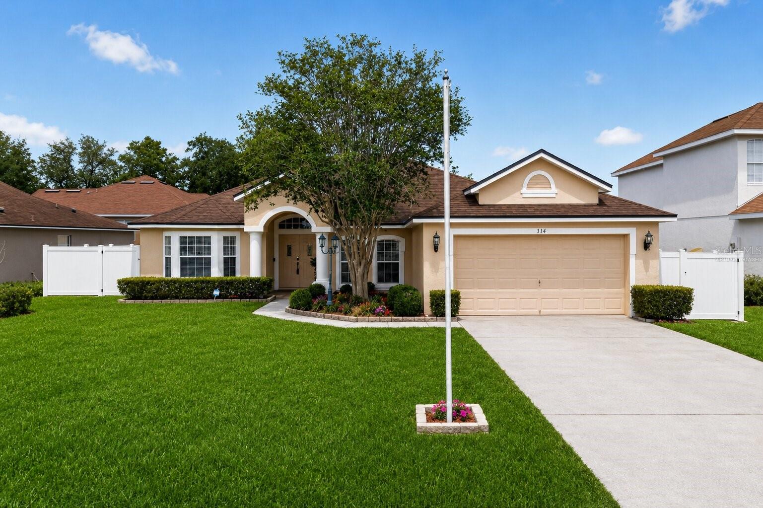 One or more photo(s) has been virtually staged. Welcome to 314 Erie Drive, a beautifully crafted custom residence where comfort, elegance, and space come together in perfect harmony. Nestled in the heart of Poinciana, this exceptional 4-bedroom, 3-bathroom home offers over 2,200 square feet of thoughtfully designed living space featuring soaring ceilings, formal living and dining areas, and an inviting open-concept layout perfect for both entertaining and everyday living.

The versatile floor plan includes a flex room ideal for a home office, den, or formal living area. In addition, the formal dining room offers the potential to be converted into a 5th bedroom, providing added flexibility to accommodate your lifestyle needs.

The spacious kitchen flows seamlessly into the family room and showcases brand-new marble countertops, stylish new light fixtures, and beautiful new laminate flooring throughout the home. The luxurious primary suite offers private access to the covered lanai and a spa-inspired bathroom complete with a garden tub, separate shower, and two walk-in closets.

Step outside to enjoy the generously sized backyard enhanced by a brand-new PVC fence with double-door entry access, providing both privacy and convenience. The third bathroom offers direct access to the backyard, making it ideal for future pool plans and convenient outdoor entertaining. Additional upgrades include a new roof and water softener system, offering added value and peace of mind for years to come.

Designed with a desirable three-way split floor plan, this home showcases elegant architectural details, charming curb appeal, mature landscaping, and a low HOA. The HOA also includes basic cable and WiFi, adding even more value to this exceptional property.