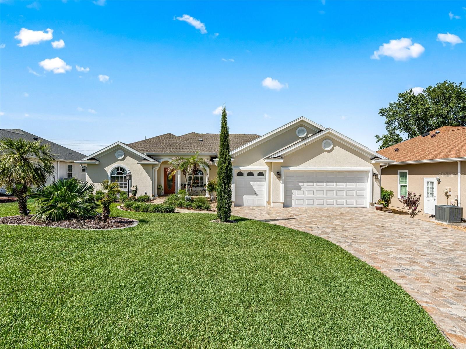 Welcome to STONECREST, a beautiful 55+ fully Gated Golf Course Community adjacent to THE VILLAGES, Florida.  This gorgeous custom Cedar Model built by Armstrong homes offers an Open and Split floor plan with 3 bedrooms (including two suites), plus a den/office, 3 bathrooms and a finished 240 sf Enclosed Lanai, and a Two Car + Golf Cart Garage on a Premium Oversized Lot with Room For A Pool!  This home underwent a to-the-studs renovation in 2022 including NEW ROOF, HVAC, Electrical, Kitchen with  Premium Appliances, Granite Countertops, Over and Under Cabinet Lighting, Pull-Out Trash, Updated Bathrooms, Flooring, New Interior and Exterior Lighting, Updated Front and Rear landscaping with Low Maintenance Native Plants and Trees, and a Custom Backyard Pergola.  The garage offers Epoxy flooring, Hurricane rated doors, and Pull own attic stairs. Originally built for the manager of Armstrong homes, Numerous Enhancements were added including 4 sets of pocket doors, two solar tubes, crown molding, arched doorways, blue tooth sound system, and access to the 3rd bathroom from the lanai.  1-4 years transferrable warranty remaining on all major appliances.  Retreat to Your Private Backyard Paradise, showcasing Professional Privacy Landscaping with enhanced Lighting features, and a Custom Pergola!  This well designed backyard creates a fantastic space for relaxing, and entertaining in style!  Enjoy the tranquility offered by the perfectly placed lighting throughout the yard, and the privacy afforded by the gorgeous tropical landscape!  

Conveniently located near physicians, hospitals, fine dining, and shopping, with easy access to I-75 and Florida’s Turnpike, this home offers a golf-cart accessible lifestyle brimming with opportunities. Put this Pristine Move-In Ready Home on your Must-See List and Make it Yours Today. Quick close available.  Now Call Cindy for your Private Showing!  A WONDERFUL LIFESTYLE AWAITS YOU IN STONECREST!