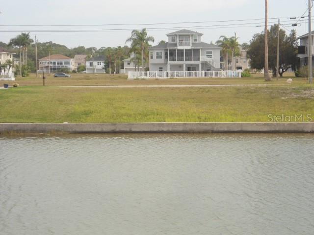Waterfront lot with SEAWALL located in deed restricted Hernando Beach South. Located three lots from the cul-de-sac you will have views of the Gulf of Mexico when you build. Included in the annual HOA Fee is the grass cutting of the lot up until you break ground to build. Come build you dream home in this waterfront community of upscale homes with access to the Gulf of Mexico. The deed restrictions in the community require you have a seawall in place before you can build.