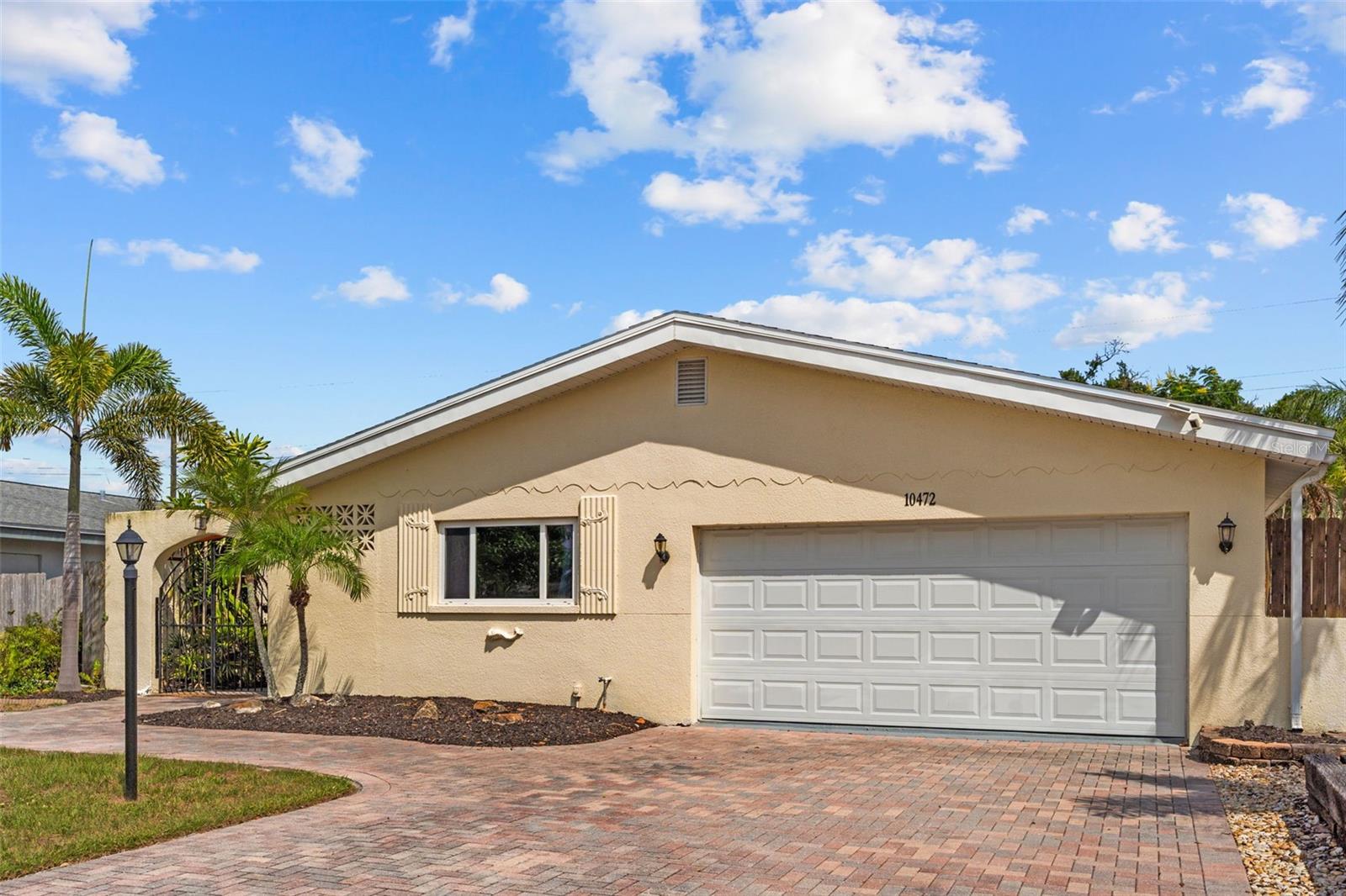 Welcome to 10472 Orange Blossom Lane, a beautifully maintained and tastefully remodeled 3-bedroom, 2-bath residence offering approximately 1,814 square feet of thoughtfully designed living space in the heart of Seminole. A freshly stained cedar courtyard creates a warm and inviting entrance, setting the tone for the stylish updates found throughout the home. Fresh interior paint and an open-concept floor plan provide a bright, welcoming atmosphere with spacious living and family areas ideal for both everyday living and entertaining. The well-appointed kitchen features quality finishes, ample cabinetry, generous workspace, a KitchenAid dishwasher (2026), and a microwave (2024). A spacious bonus game room with a built-in bar overlooks the pool, creating the perfect space for game days, entertaining guests, or simply relaxing while enjoying the backyard views.

Step outside to your private backyard retreat featuring a heated swimming pool, a charming gazebo, and plenty of space for outdoor dining, entertaining, or peaceful evenings at home. This home has been meticulously maintained with major updates, including impact sliding glass doors (2021), windows (2017), electrical panel (2017), HVAC (2024), pool heat pump (2023), and a Pentair variable-speed pool pump (2025), providing both comfort and peace of mind for years to come.

Ideally located just minutes from award-winning Gulf beaches, beautiful parks, shopping, dining, and top-rated schools, this exceptional home offers the perfect combination of modern updates, timeless style, and an unbeatable location. Move-in ready and designed for the Florida lifestyle, this is a rare opportunity to own a home that truly has it all.