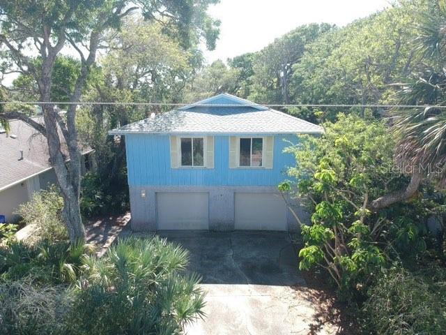 PRICE REDUCED!  Don't miss the opportunity to make this Your Perfect Beachside Home.  New Roof 2021, New Hot Water Heater 2021, Upgraded Impact Resistant/Low E Windows and Sliders, Updated Kitchen and New Appliances!  So many possibilities in this spacious, split-level home and just a quick walk to the beach! The second level offers an open floor plan, large great room and updated kitchen opening onto the back deck.  3 bedrooms and 2 full baths complete the second level.  The fourth bedroom, full bath, and den are located on the first level with separate entrance with an oversized 2 car garage. ;Water: City
