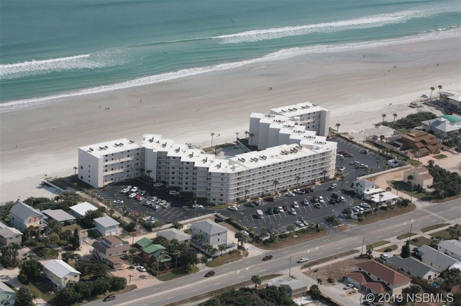 Direct Oceanfront Condo has floor-to-ceiling sliding glass doors, which offers amazing views of the ocean. Elegance and superior design are the hallmarks of this condo from a custom kitchen. The kitchen has a microwave, flat surface stove with oven and refrigerator for entertaining. With families in mind, the dinning room table seats 4 with 2 bar stools. The living room has a large screen TV, comfortable seating and a sleeper sofa. A/C & hot water heater installed 2018. New impact sliding glass door & window will be installed in December.  The unit has a rental history of $20k for 2019 and $12k confirmed for 2020.  The Association has the reputation of being one of the best condominiums on the ocean due to the on-site association and rental management. The complex offers WIFI in all units.  The rental profit is applied towards the annual operating budget for the benefit of the homeowners. Let us not forget the washer and dryer inside. The condo complex has 2 pools, one seasonally heated, shuffle board and a brand new social hall, bike parking and gas grills. ;LocationDescription: Condo ;Water: City