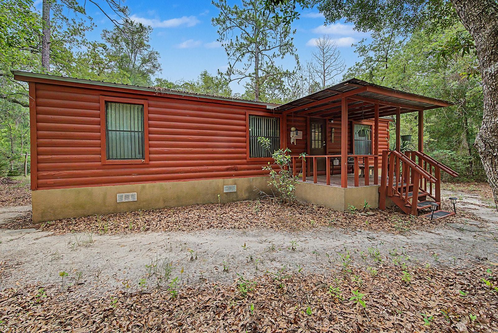 Escape to the peaceful countryside of Bell, Florida with this charming 3-bedroom, 2-bath home situated on 2 fully fenced and gated acres. Offering plenty of room to spread out, this property combines privacy, functionality, and convenience in a desirable North Florida location. Outside, you'll find a spacious pole barn perfect for storing equipment, boats, RVs, or recreational vehicles, along with an additional storage shed for tools and outdoor gear. The gated entrance and fenced acreage provide security and plenty of space for pets, gardening, hobbies, or simply enjoying the outdoors. Located just down the road from the Log Landing Public Boat Ramp, this property is ideal for boating, fishing, and nature enthusiasts who want quick access to the Suwannee River. Whether you're looking for a full-time residence, a weekend retreat, or a place to enjoy the laid-back Florida lifestyle, this property offers the perfect blend of country living and outdoor recreation. Conveniently located near Bell, Branford, and Chiefland, you'll enjoy easy access to local shopping, dining, schools, and some of the area's most popular natural springs and waterways. Don't miss this opportunity to own your own piece of Florida paradise!