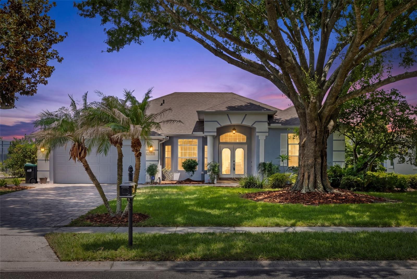 Welcome to this stunning lakefront pool home on Big Sand Lake, a 1,000+ acre private ski lake in the heart of Dr. Phillips. Offering breathtaking water views, a private dock with boathouse, and an exceptional outdoor living experience, this property captures the very best of Florida waterfront living. Ideal for boating, waterskiing, wakeboarding, paddleboarding, fishing, and sunset cruises, Big Sand Lake provides endless opportunities for recreation right from your own backyard.

The backyard is a true retreat, featuring a spacious screened patio, sparkling pool, and expansive pool deck overlooking the tranquil waters of the lake. Whether you're enjoying a peaceful morning sunrise, entertaining guests, or spending the day on the water, this outdoor oasis provides the perfect setting. Nature lovers will appreciate the nearby trail with direct access to Dr. Phillips Community Park, offering playgrounds, sports fields, picnic areas, and a popular dog park.

Inside, you'll find a bright and inviting open-concept split floor plan designed for both comfortable living and effortless entertaining. The welcoming foyer opens to the formal living room, where sliding glass doors frame beautiful lake views and provide access to the outdoor living space. Just off the foyer, the formal dining room flows seamlessly into the kitchen and family room.

The well-appointed kitchen features stainless steel appliances, a center island, stunning new granite countertops, abundant cabinetry, and a sunny breakfast nook overlooking the pool and lake. The adjacent family room offers built-in shelving and sliding glass doors to the pool deck, creating an ideal gathering space for family and guests.

The private primary suite is situated on the right side of the home and features a beautifully updated en-suite bathroom with a freestanding soaking tub, large walk-in shower, and dual walk-in closets. Connected to the primary suite is a private office with sliding glass doors leading directly to the patio, providing a peaceful workspace with inspiring lake views.

On the opposite side of the home, two secondary bedrooms share a full bathroom. Toward the rear of the home, a fourth bedroom and third full bathroom offer additional privacy and flexibility for guests, extended family, or multi-generational living. The third bathroom also provides convenient access from the pool area.

Additional features include a two-car garage, an interior laundry room, and abundant storage throughout the home. Luxury vinyl flooring extends through all bedrooms and most living areas, while ceramic tile enhances the kitchen, family room, and bathrooms.

Recent updates include a NEW HVAC system, fresh interior paint, refinished kitchen and primary bathroom cabinetry, a new refrigerator, new dishwasher, upgraded granite countertops, and numerous additional improvements.

Ideally located near world-class shopping, dining, and entertainment, this exceptional home also offers convenient access to I-4, making commutes to Downtown Orlando, the Walt Disney World Resort area, Universal Orlando, Orlando International Airport, and Florida's beautiful beaches quick and convenient.

Whether you're seeking a peaceful waterfront retreat, a home designed for entertaining, or a property that embraces an active boating and watersports lifestyle, this rare Big Sand Lake opportunity delivers the very best of Central Florida lakefront living.