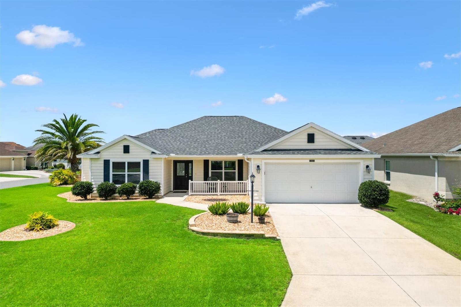 Welcome to this beautifully maintained 3-bedroom, 2-bath Palm Beach 4 Designer home with a 556 SF EXPANDED GARAGE, ideally located in the highly sought-after VILLAGE OF LABELLE SOUTH. Perfectly located, this exceptional home is just a 1-minute walk to the Adult Pool and only a 5-minute stroll to Belle Glade Country Club, offering the ideal blend of convenience and lifestyle.
A newer roof (2025), new sod, newly painted interior and fresh landscaping provide outstanding curb appeal, making this home truly move-in ready.
Step inside to a light-filled, open floor plan enhanced by vaulted ceilings, luxury laminate flooring in the living room, hall and bedrooms, tile throughout the remaining areas—no carpet anywhere! The spacious kitchen is designed for both everyday living and entertaining, featuring Beautiful cabinetry with pull-out shelves, pot drawers, a large breakfast bar, and STAINLESS STEEL appliances (the Refrigerator and Oven are approximately two years old)).
The open-concept living and dining area flows seamlessly to the triple stacking sliding door leading to the expanded south facing covered and screened lanai complete with a privacy electric roll-down shade and new epoxy-coated floor.  Just outside is a large paver patio with a sitting wall that is the perfect space for grilling, relaxing, sunning, or entertaining family and friends.
The spacious Primary Bedroom offers a beautiful tray ceiling, a large walk-in closet, an ensuite bathroom with dual sinks, a private water closet, and a tiled Roman walk-in shower with a seat. The 2 guest suites and guest bath are located on the opposite side of the home giving your guests plenty of privacy.
Additional features include an inside laundry room with a utility cabinet sink, overhead cabinetry, a large storage closet along with another storage closet in the hallway.  The laundry room has direct access to the OVERSIZED GARAGE with an epoxy-coated floor.  This home features lots of storage and closet space. This home also features a Pegasus home water softener system.
The 2018 Yamaha gas golf cart is available separately, making it even easier to enjoy The Villages lifestyle.
Conveniently located near championship golf, recreation centers, pools, shopping, dining, medical facilities, and nightly entertainment, this meticulously maintained home offers the perfect combination of comfort, style, and location.
Be sure to watch the video tour to fully appreciate everything this exceptional home has to offer!