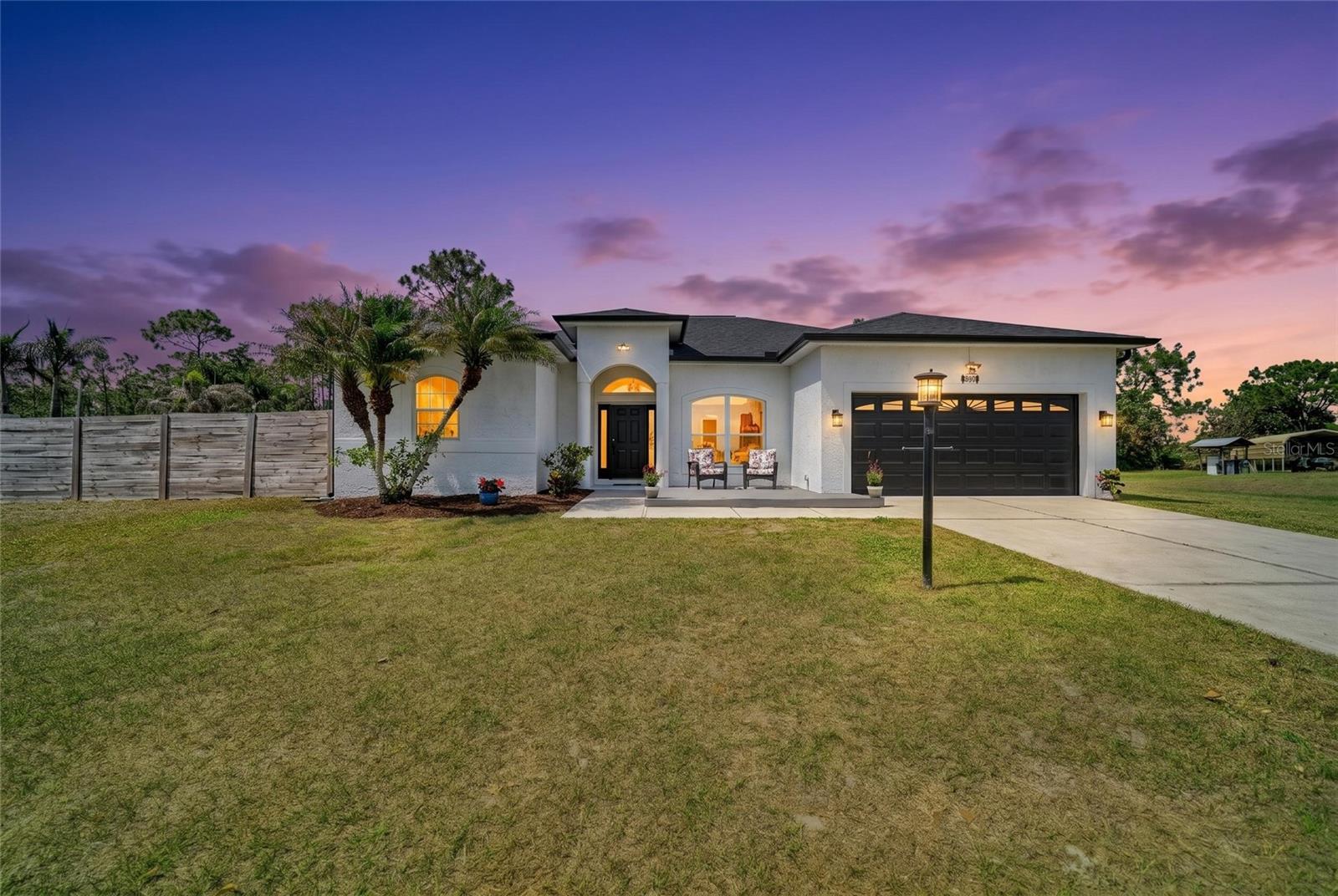 This estate-style residence offers a rare blend of refined privacy and complete freedom on a spacious .53-acre lot in Myakka City. Meticulously de-risked for the sophisticated buyer, the property features a brand-new roof installed in 2025 and a high-efficiency 17 SEER rated Trane HVAC system replaced in 2021, ensuring the primary structural elements of this Manatee County estate are optimized for long-term performance. Freshly curated with designer paint inside and out, the home serves as a secure sanctuary fully enclosed by a 2024 privacy fence and professional-grade invisible pet fencing. Strategically positioned in Flood Zone X with an intentionally raised base elevation, the home is engineered for superior drainage and sits prominently on a high-percolation lot, offering maximum structural protection without the requirement for flood insurance. The thoughtfully designed 4-bedroom, 3-bathroom layout plus a dedicated den features a central open-concept living area and a master suite with direct access to the salt-water pool and screened lanai. Intentional upgrades include an updated water filtration system with an under-sink reverse osmosis unit for high-quality drinking water, a dedicated exterior-access pool bath for guests, and custom storage in the two-car garage. Positioned in a unique non-deed restricted enclave with no HOA or CDD fees, this estate allows for on-site RV and boat storage and offers operational autonomy via private well and septic systems. While providing a secluded country escape, the property remains exceptionally well-located near the upscale dining and shopping of Lakewood Ranch and UTC, as well as the world-renowned Gulf beaches of Bradenton and Sarasota. Own what’s real!