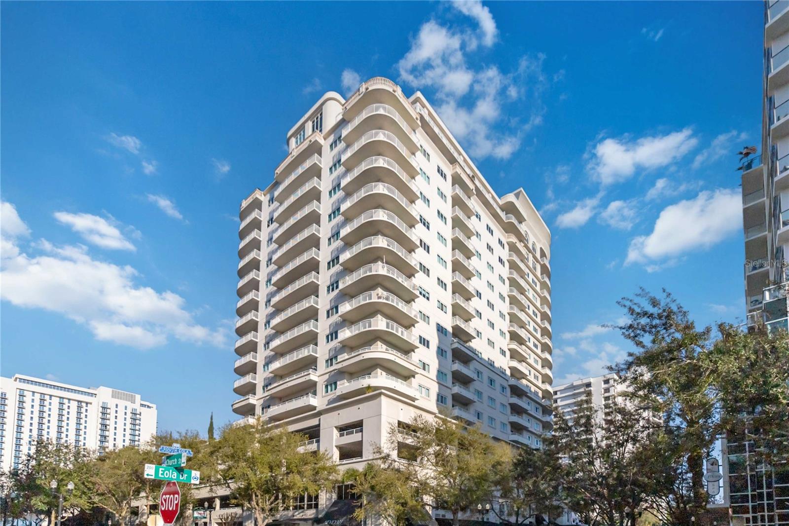 Welcome to Residence 914 at The Sanctuary Downtown, one of Orlando’s premier luxury condominium residences, ideally situated in the heart of the vibrant South Eola District.

Offering over 2,000 square feet of thoughtfully designed living space, this exceptional home features rich hardwood flooring, custom built-ins, expansive living and dining areas, and an inviting wraparound balcony overlooking the resort-style pool and amenity deck. Large windows throughout the residence fill the home with natural light, creating a bright and welcoming atmosphere perfect for both everyday living and entertaining.

A rare downtown offering, Residence 914 includes two deeded parking spaces, providing exceptional convenience and value.

Residents of The Sanctuary enjoy an impressive collection of luxury amenities, including 24-hour concierge service, a resort-style swimming pool, fitness center, steam room, jacuzzi, resident gathering lounge, secure access, and beautifully maintained common spaces.

Located just steps from Lake Eola Park, Thornton Park, premier dining, cafés, shopping, and entertainment, this residence offers the very best of downtown Orlando living. Enjoy morning walks around the lake, evenings on your private balcony, and the convenience of having the city’s most desirable destinations just outside your door.

Combining generous living space, exceptional amenities, and an unbeatable location, Residence 914 presents a rare opportunity to experience luxury urban living at The Sanctuary Downtown!