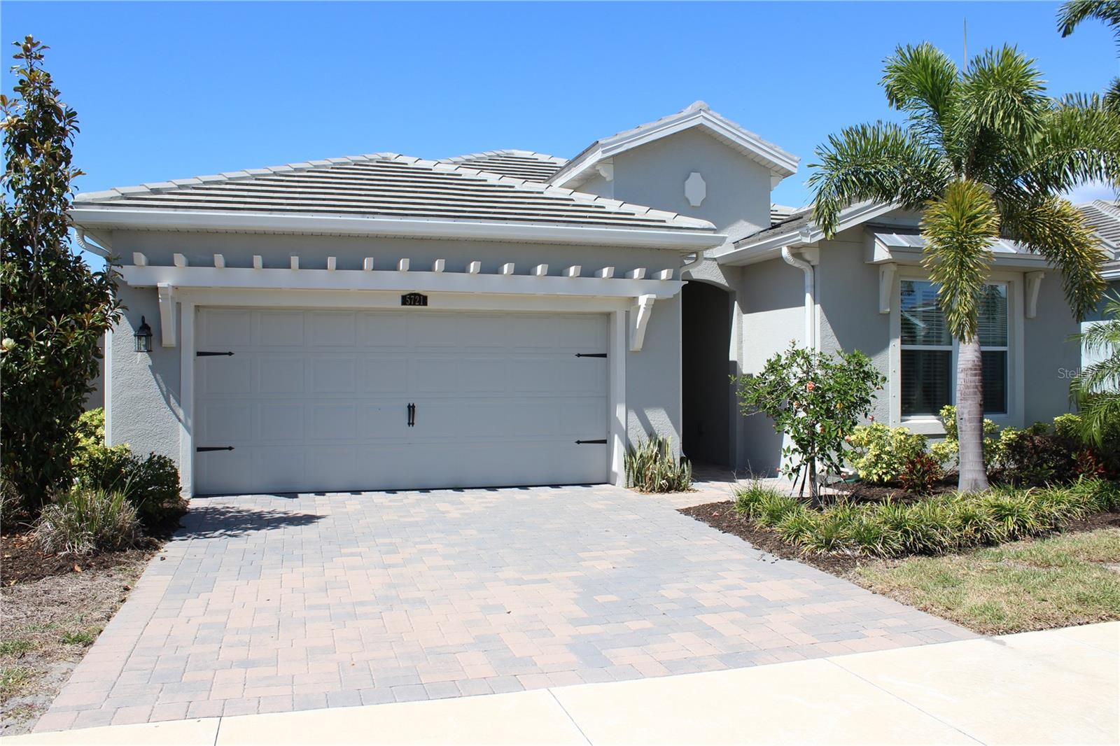 Welcome to this beautifully maintained newer-construction home in one of Sarasota’s most desirable Palmer Ranch communities. Built in 2022, this single-story residence offers 3 bedrooms, 2 bathrooms, and over 2,000 square feet of thoughtfully designed living space. From the moment you step inside, you’ll notice the open-concept layout filled with natural light, creating a seamless flow between the living, dining, and kitchen areas. The kitchen is designed for both functionality and style, featuring modern finishes, ample cabinetry, and a spacious island perfect for everyday living or entertaining. The primary suite offers a private retreat with a well-appointed ensuite bath and generous closet space, while the additional bedrooms provide flexibility for guests, a home office, or additional living needs. Step outside to enjoy the covered lanai and backyard space, ideal for relaxing or enjoying Sarasota’s year-round sunshine. This home includes 3 bedrooms, 2 bathrooms, 2,092 sq ft of living space, was built in 2022, features an open-concept floor plan with abundant natural light, an attached garage and modern finishes throughout, and is located on a quiet loop street in Palmer Ranch. Situated just minutes from shopping, dining, top-rated schools, and a short drive to Siesta Key’s world-renowned beaches, this home offers both convenience and lifestyle. Available for lease, homes like this, in this location and condition, tend to move quickly.