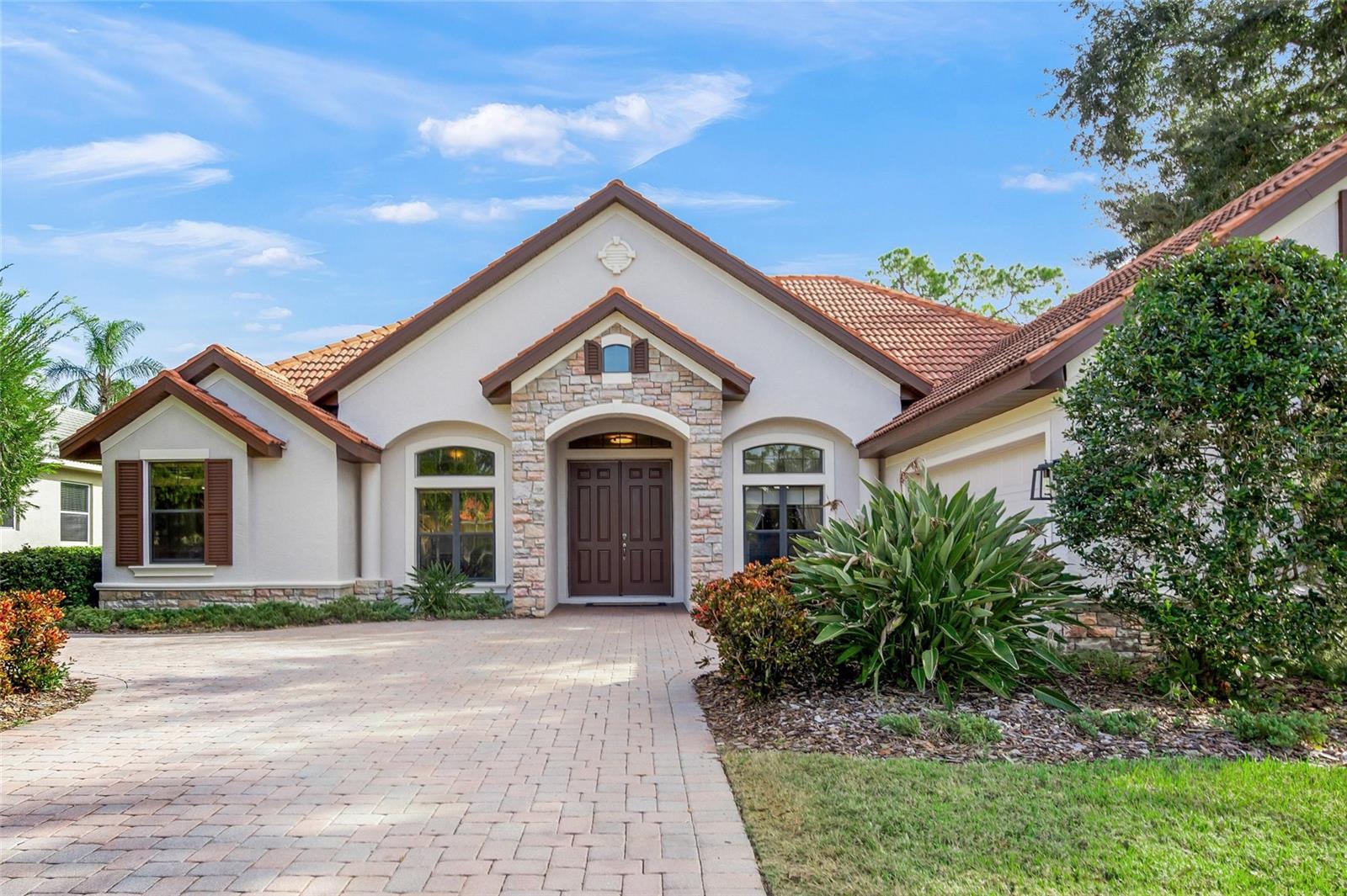 Discover exceptional Sarasota living in this exclusive gated enclave of just 11 homes, where privacy, elegance, and convenience come together seamlessly. Ideally situated near Clark and Proctor roads, NOT IN A FLOOD ZONE, and just 3 miles to World Famous Siesta Key, this impeccably designed residence by Vision Homes offers 3 bedrooms plus a dedicated office, 3 full baths, and a thoughtful floor plan perfect for both everyday comfort and sophisticated entertaining.
Inside, generous living spaces include a formal dining room with tray ceiling, a spacious living room with impressive custom crown molding, and an inviting family room—all highlighted by refined architectural details such as double and single step crown molding, tray ceilings, and pristine tile flooring with newer plush carpeting in the bedrooms.  A private front-of-home office features an elegant double door entry.  At the heart of the home, the remodeled chef’s kitchen shines with NEWER high-end stainless steel appliances, sleek granite countertops, custom wood cabinets, marble backsplash, and a large island with Fine Alabaster pendant lights overlooking the family room. A sunlit breakfast nook with an aquarium window frames peaceful views of the outdoor oasis. The primary suite is a true retreat, complete with dual walk-in closets, a tray ceiling, and a spa-inspired en-suite bath featuring dual sinks, a soaking tub, and a luxurious walk-in shower. Additional bedrooms and bathrooms are equally well-appointed, offering comfort and privacy for family and guests.  Step outside to an expansive travertine lanai (recently cleaned/sealed), where a sparkling pool/spa that was just resurfaced June 2026 with PebbleTec create the perfect setting for year-round outdoor living and features 2 covered seating areas accented by warm wood ceilings.  The rear extended lanai is perfect for outdoor dining and features outdoor cabinets with a natural stone countertop.  An oversized side-load two-car garage with attic access provides added convenience and ample storage.  Peace of mind knowing the A/C was replaced 11/2021, the main rooms were recently painted, and there's a well for irrigation!  This neighborhood was high and dry for all storms - and does not require Flood Insurance.  Nathaniel Place is directly across from beautiful Red Bug Slough, and close to top-rated schools, shopping, dining, and Sarasota’s famed Gulf beaches.  Homes in this intimate, upscale community rarely become available—don’t miss your opportunity. Call today for more details and to schedule your private showing before this exceptional property is gone.