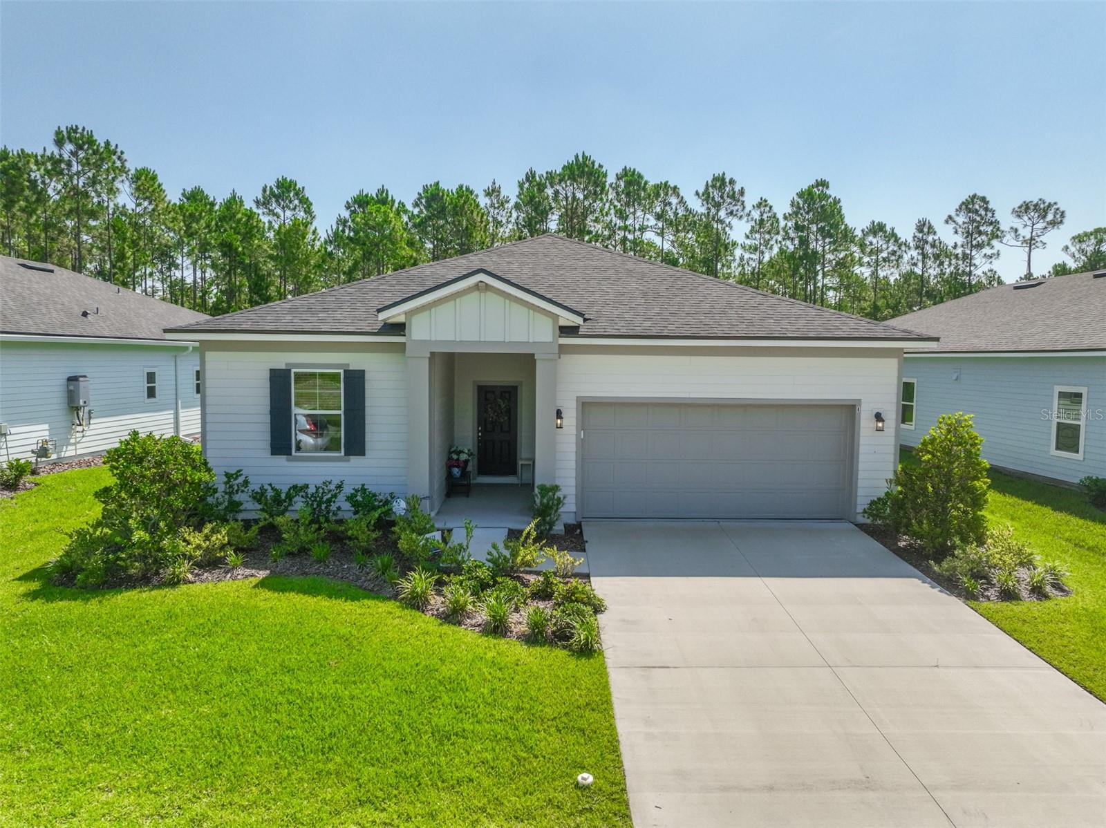 Welcome to your dream active adult in the highly desirable 55+ community of Reverie at Palm Coast! Built just two years ago, this immaculate home features the sought-after, extended Casper floor plan for expanded, open-concept living space on a beautiful Cul-de-sac street!  Highlights include Gourmet Kitchen with Natural gas cooktop, quartz counters, a massive island with storage, and upgraded lighting fixtures and fans  throughout the home.  Plenty of storage throughout and Second bedroom has a walk-in closet. The Flex Room has solid doors for optimal privacy, perfect for a quiet guest room or office.  Access the brand-new community clubhouse, golf simulator, and sparkling pool. Great location close to Flagler Beach and St. Augustine and Daytona Beach are just a short drive away!  Skip the wait for new construction—schedule your tour today!