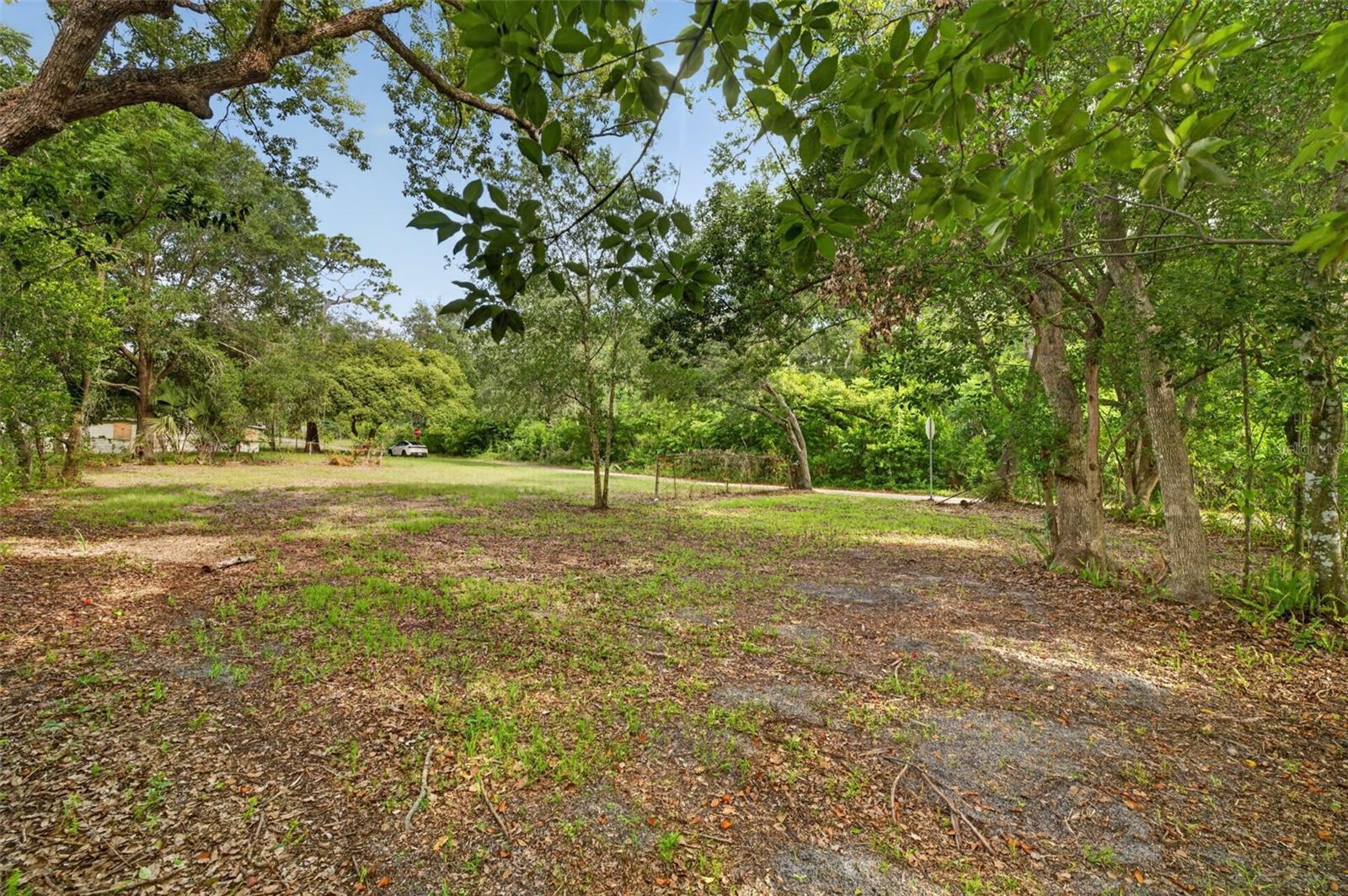 Tucked beneath a canopy of mature trees in the heart of Lake Mary, this cleared corner lot offers the perfect opportunity to build your dream home in an established neighborhood setting. With beautiful natural surroundings and plenty of space to create your ideal design, the property is ready for your vision to come to life. Conveniently located just minutes from Downtown Lake Mary, the SunRail station, shopping, dining, major highways including 417, and top-rated Seminole County schools, this homesite combines peaceful residential living with easy everyday access and commuting convenience.