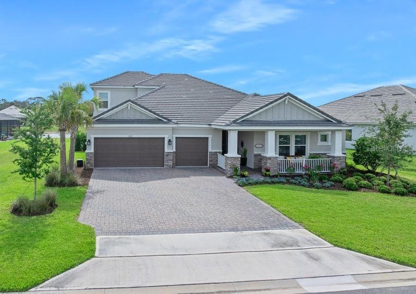 Why wait to build when you can move right into this tastefully upgraded, custom built home that's only three years young? Located in the gated community of Windchase at Halifax Plantation, this exceptional Sunset floor plan offers 3312 square feet of thoughtfully designed living space featuring 5 bedrooms, 4 1/2 bathrooms, a private study, bonus/game room, and a spacious 3-car garage. From the moment you enter, you'll appreciate the home's open and inviting design especially when you are greeted with breathtaking water views! The formal foyer leads to three secondary bedrooms and two full bathrooms before opening into the expansive gathering room and designer gourmet kitchen. This kitchen is a chef's dream complete with a large center island, double ovens (one convection), an induction cook top, abundant cabinetry, and finishes ideal for both everyday living and entertaining. Cascading sliders lead to a covered lanai which extends the living space outdoors thus creating a seamless

indoor-outdoor living experience and the perfect setting for relaxing or hosting guests. The private primary suite is tucked away at the rear of the home and serves as a true retreat, offering dual custom walk-in closets, separate vanity areas, and a spacious bath designed for comfort and convenience. This home was originally built with numerous premium structural upgrades, including tray ceilings, a gourmet kitchen, study, game room, an en-suite bath for Bedroom 2, and upgraded bathroom layouts. Since moving in, the owners have taken this home to the next level. They have added several stunning built-ins: a kitchen buffet/coffee bar, a beverage station/wine bar in the gathering room and a wet bar/snack bar conveniently located in the 2nd floor bonus room. Additionally, they designed a built-in work station in the study and added custom wood accents throughout the home. Not to be ignored is the professionally finished epoxy garage floor, enhancing both functionality and luxury in this very spacious garage/workspace. The Windchase community offers the security and exclusivity of a gated neighborhood while enjoying all the amenities of Halifax Plantation, one of the area's premier golf communities. Residents enjoy an 18-hole championship golf course, elegant clubhouse dining, a casual sports pub, Junior Olympic-sized swimming pool, tennis, pickleball, and a fitness center. Ideally located just three miles from I-95, this home provides convenient access to shopping, dining, healthcare, and everyday services while the Intracoastal Waterway and beautiful Atlantic Ocean and beaches are only minutes away. This is a rare opportunity to own a nearly new, move-in-ready home with thousands of dollars in additional custom upgrades already completed for you. Easy to see and a pleasure to show.