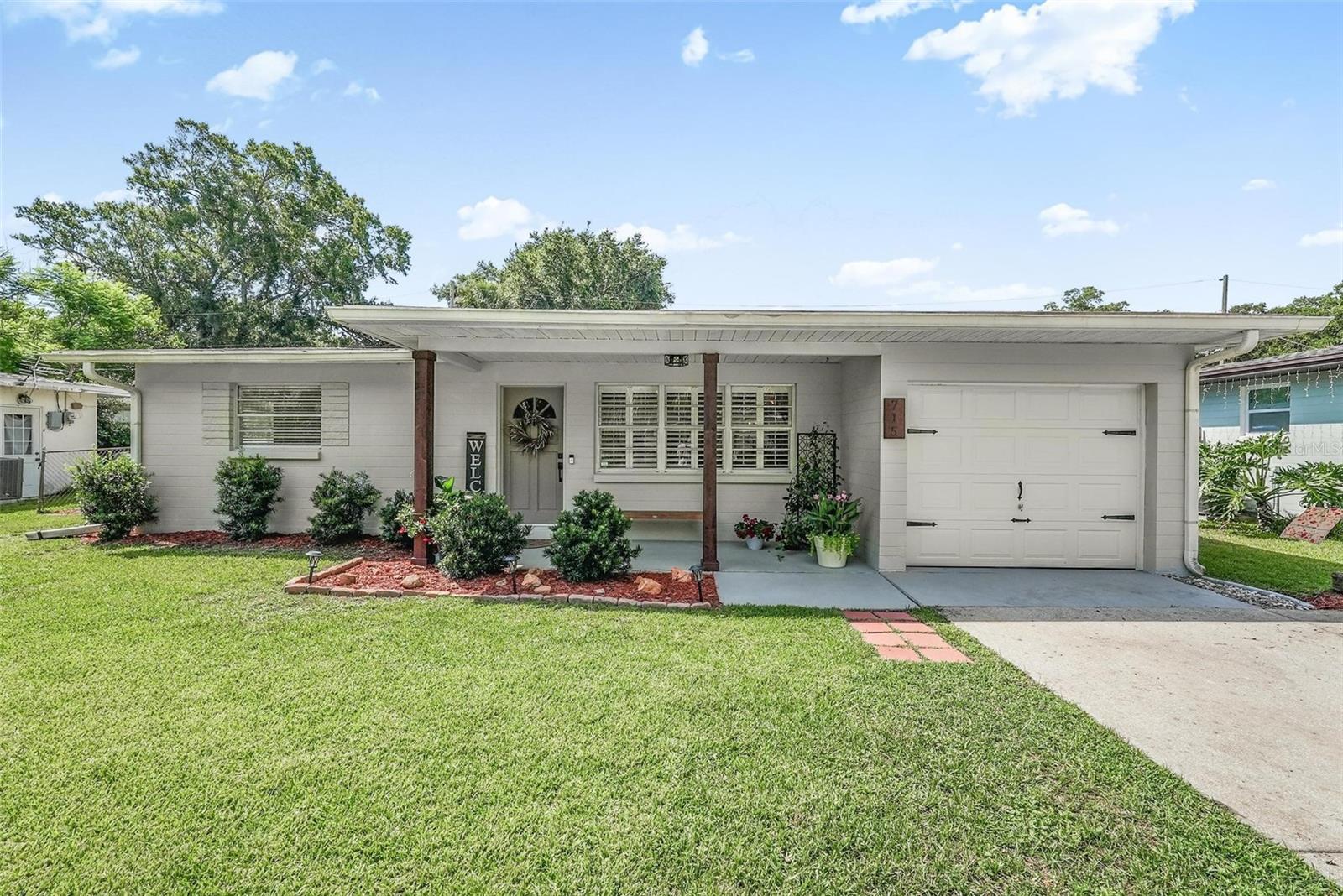 Spacious and full of potential, this  home offers comfort, functionality, and room to grow. Featuring 3 bedrooms, 1.5 bathrooms, and approximately 1,400 square feet of living space, this home sits on a generously sized lot with a fully fenced backyard and no HOA.

As you step inside, you'll appreciate the bright and inviting interior, highlighted by luxury life-proof vinyl flooring, dimmable recessed lighting, modern light fixtures, and thoughtful updates throughout. The functional floor plan provides comfortable living spaces for families, first-time homebuyers, or anyone seeking a low-maintenance Florida lifestyle. Energy-conscious buyers will also appreciate the solar panel system, adding efficiency and potential savings.

Step outside to your own private backyard retreat, complete with mature shade trees, beautifully maintained landscaping, winding garden pathways, and plenty of room to entertain, play, or simply relax. The screened-in patio offers the perfect place to enjoy your morning coffee or unwind in the evenings, while the large workshop/shed provides endless possibilities for storage, hobbies, or a home workspace.

Conveniently located near shopping, dining, schools, parks, and everyday amenities, this move-in-ready home offers exceptional value and space both inside and out. Priced to sell — you won't want to miss this one!