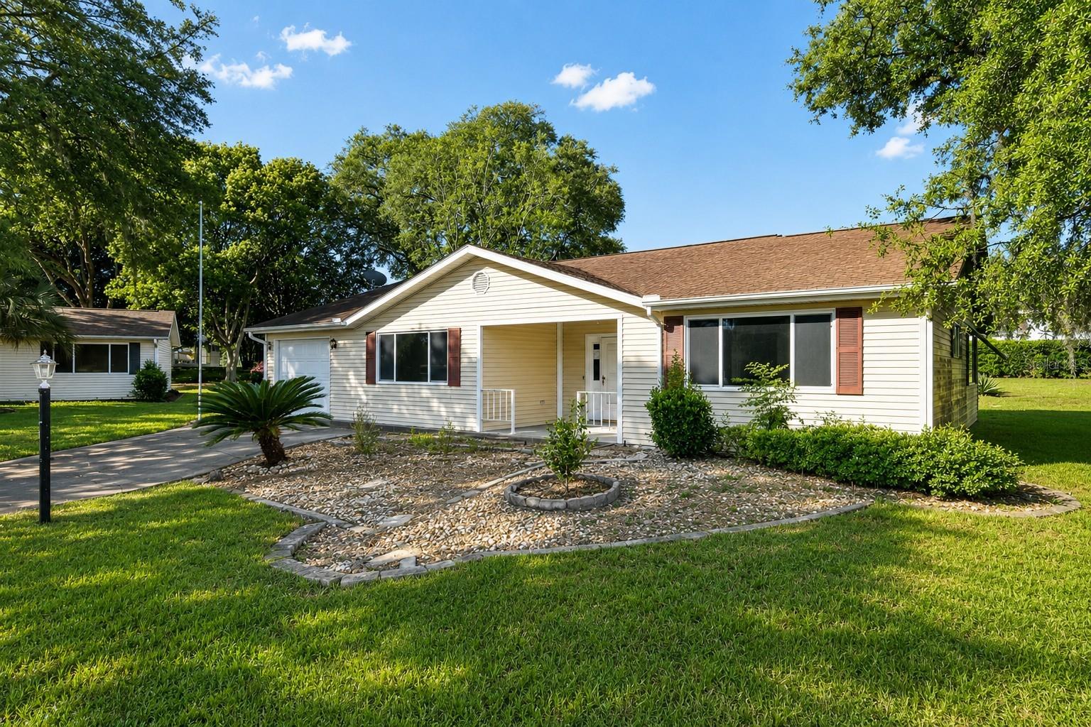 Welcome to 10920 SW 82nd Terrace, where comfort, convenience, and the vibrant Florida lifestyle come together in one of Ocala’s most sought-after 55+ gated communities. Nestled within Oak Run, this inviting single-story residence offers approximately 1,762 square feet of thoughtfully designed living space, featuring 3 bedrooms, 2 full bathrooms, and a layout that perfectly balances everyday comfort with effortless entertaining. From the moment you arrive, the home's welcoming curb appeal, charming front porch, and mature landscaping create an inviting first impression. Step inside to discover a bright, open interior where natural light fills the spacious living areas, enhanced by soaring vaulted ceilings that create an airy sense of openness. The seamless flow between the living and dining spaces provides the perfect setting for hosting family gatherings, relaxing with friends, or simply enjoying peaceful evenings at home. At the heart of the home, the generously sized kitchen offers abundant cabinetry, ample workspace, and a comfortable dining area where everyday meals become moments to enjoy. Whether preparing dinner, entertaining guests, or gathering for morning coffee, this space is designed to bring everyone together while remaining both functional and welcoming. The thoughtfully designed split-bedroom floor plan offers privacy for homeowners while providing comfortable accommodations for family or overnight guests. The spacious primary suite serves as a peaceful retreat, complete with a walk-in closet and a private ensuite bathroom designed for everyday comfort. Two additional bedrooms provide exceptional flexibility, making them ideal for guests, a home office, hobby room, or creative space to fit your lifestyle. Step through the sliding glass doors and discover one of the home's most enjoyable features—a large screened lanai that extends your living space outdoors. Whether you're sipping your morning coffee, enjoying the Florida breeze, or hosting friends for an evening gathering, this versatile space offers year-round enjoyment while allowing you to appreciate the peaceful surroundings in comfort. An attached one-car garage provides additional convenience along with extra storage space, while the home's practical floor plan makes everyday living both comfortable and efficient. Beyond your front door, Oak Run offers an exceptional resort-style lifestyle with beautifully maintained grounds, multiple clubhouses, sparkling pools, fitness centers, golf, tennis, pickleball, scenic walking paths, and an incredible variety of clubs and social activities that make every day feel like a vacation. Whether you're searching for your full-time Florida residence or the perfect place to enjoy an active retirement, 10920 SW 82nd Terrace offers the ideal combination of comfort, functionality, and community living. Don't miss this opportunity — schedule your private showing today! Photos are digitally enhanced. Being sold AS IS, WHERE IS, Buyer is responsible for all inspections and any city requirements to close. All information and property details set forth in this listing, including all utilities and all room dimensions which are approximate and deemed reliable but not guaranteed and should be independently verified if any person intends to engage in a transaction based upon it. Seller/current owner does not represent and/or guarantee that all property information and details have been provided in this MLS listing.