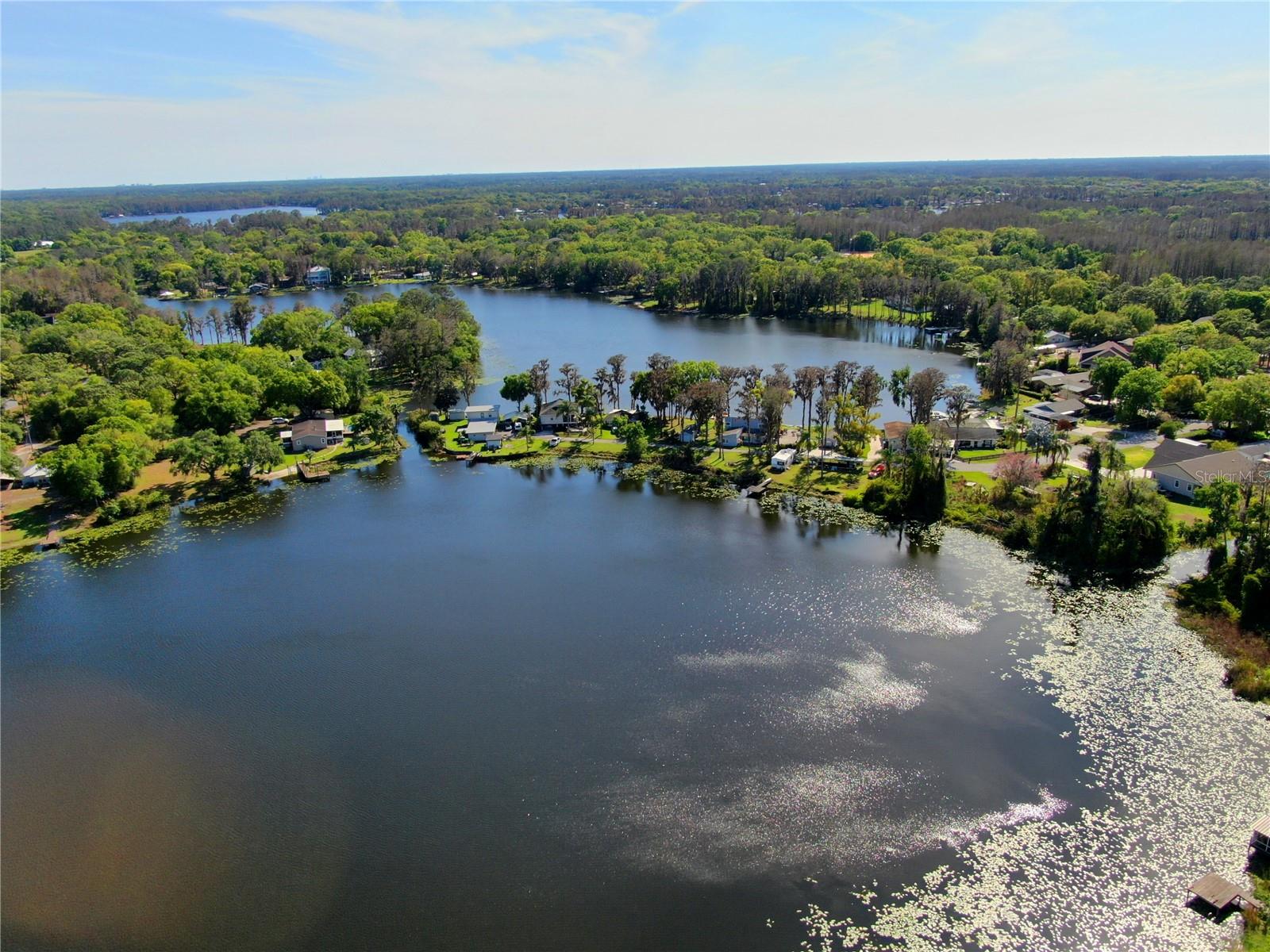 One or more photo(s) has been virtually staged. Rare waterfront opportunity on beautiful Lake Geneva in desirable Odessa. This property offers canal access to ski Lake Minneola, giving you the chance to enjoy two connected lakes and the lifestyle that comes with them.

The true value here is in the land and the waterfront setting, but the property also includes a permanently installed 2-bedroom, 2-bath doublewide mobile home that offers flexibility while you plan your future build. The home is not currently connected to a well, so a new well will need to be installed, but it presents potential to live in or rent out while you design and build your dream home.

Enjoy fishing, boating, skiing, swimming, or simply relaxing in your own backyard while taking in the peaceful water views and cool lake breezes. Opportunities like this are increasingly rare — waterfront property with access to two connected ski lakes for under $200,000.

With no HOA or CDD, the possibilities are wide open. Build a custom waterfront home, create a weekend retreat, hold as an investment, or enjoy it as your own private getaway.

Conveniently located near great schools, restaurants, shopping, parks, outdoor recreation, the Veterans Expressway, Tampa International Airport, and some of Florida’s best Gulf Coast beaches.

Bring your builder, your vision, and your imagination.
