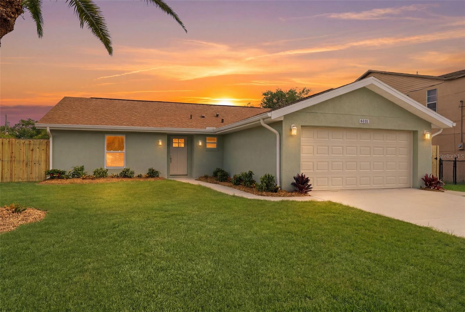 Virtually Staged. Tucked away on a peaceful cul-de-sac, this beautifully reimagined 3-bedroom, 2-bath residence has been completely remodeled from top to bottom, blending timeless style with everyday comfort. Set on a fenced 0.15-acre homesite, the property offers a thoughtfully designed layout, a spacious 2-car garage, and an impressive list of recent upgrades, including a new roof installed in May 2026, brand-new impact windows, new plumbing, a new electrical panel, and a brand-new HVAC system with all new ductwork and a transferable HVAC warranty, providing peace of mind for years to come. Step inside and immediately feel at home. The welcoming foyer is accented by light wood-look luxury vinyl flooring that flows seamlessly throughout the home, creating a bright and cohesive feel. A custom-built drop zone with a bench, cabinetry, open shelving, and coat hooks provides the perfect place to keep life organized from the moment you walk through the door. At the heart of the home, the expansive living room invites you to gather and relax, featuring a new built-in electric fireplace, abundant natural light streaming through the impact windows, and sliding glass doors that effortlessly connect indoor and outdoor living. Whether hosting friends or enjoying a quiet evening, this space offers warmth and versatility for every occasion. The beautifully updated kitchen is designed to impress, combining elegant finishes with practical functionality. Granite countertops, extensive cabinetry, new stainless steel appliances, and a convenient breakfast bar provide plenty of space for meal preparation and entertaining. Just beyond, the sunny breakfast nook overlooks the backyard, creating the perfect setting for morning coffee or casual family meals. Privately situated, the primary suite serves as a tranquil retreat with multiple windows that fill the room with natural light, dual built-in closets, and an updated en-suite bath. The spa-inspired bathroom features crisp white cabinetry, granite countertops, and a walk-in shower wrapped in floor-to-ceiling white tile for a clean, sophisticated look. The secondary bedrooms continue the home's fresh, modern aesthetic with matching luxury vinyl flooring, ample closet space, and abundant natural light. The guest bathroom has been thoughtfully updated with white cabinetry, granite countertops, and a tub-shower combination enhanced by stylish decorative tile accents. Bedroom three, located near the front of the home, offers exceptional flexibility as a guest room, home office, creative studio, or hobby space. Additional conveniences include an interior laundry room complete with a utility sink and direct access to the garage. Outside, the screened lanai provides a peaceful extension of the living space, featuring paneled ceilings and full-height screening that overlooks the fully fenced backyard. Whether enjoying a quiet morning, an evening breeze, or weekend gatherings, this outdoor retreat offers the perfect backdrop for Florida living. Ideally located in Hudson, you'll enjoy easy access to some of the area's most beloved outdoor destinations, including Hudson Beach for breathtaking Gulf sunsets and waterfront dining, Werner-Boyce Salt Springs State Park for kayaking and scenic nature trails, and SunWest Park with its crystal-clear freshwater lagoon, sandy beach, and endless recreational opportunities. This move-in-ready home offers the perfect combination of modern updates, comfort, and Florida lifestyle living.