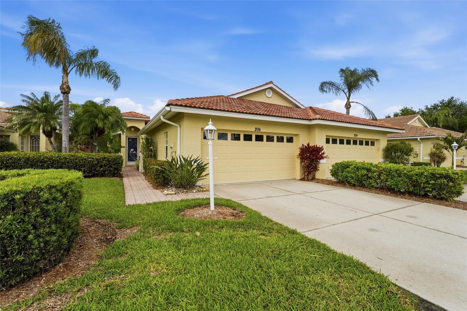 PRICE IMPROVEMENT! Turnkey furnished and extremely well-appointed, this 2-bedroom, 2-bathroom villa (with 2-car garage!) is an affordable entry point to low-maintenance Florida living! This home features a newer TILE roof (2023), brand new water heater (2026) and is in the lower-risk X flood zone. Enjoy this ideal location in the heart of Venice! Vista del Lago, a quiet enclave of just 50 homes, is just 3 miles to Historic Downtown Venice and famous Gulf Coast beaches beyond. Centrally located, but offering full tranquility with a screened lanai overlooking a quiet pond, a peaceful spot to enjoy watching the local birdlife: herons, osprey, egrets and more! 
A gated front patio with tropical plants leads inside to a flexible floorplan with both a living room and family room/den area, easily customizable to fit how you live. High ceilings lend an open, airy feel with an abundance of natural light. There is ample space for an eating area off the kitchen, as well as a breakfast bar. The primary bedroom has water views, ensuite bathroom and large walk-in closet. The 2nd bedroom is located at the opposite end of the home providing privacy for all. Indoor laundry room with washer/dryer and a handy utility sink.
In addition to lawn, landscaping and irrigation, the modest HOA fee includes a heated community pool and Clubhouse for residents. Restaurants, boutique shopping, Venice Theatre, and Centennial Park for a variety of events and concerts are all nearby, as are the practical things like groceries, banks and medical facilities. For walkers and cyclists, the Legacy Trail and the Venetian Waterway are also close, or play a round of golf at one of the many local courses. Whether you’re looking for a seasonal escape or a full-time residence, this is a rare opportunity to secure a slice of the Florida dream in a community that feels like a well-kept secret.