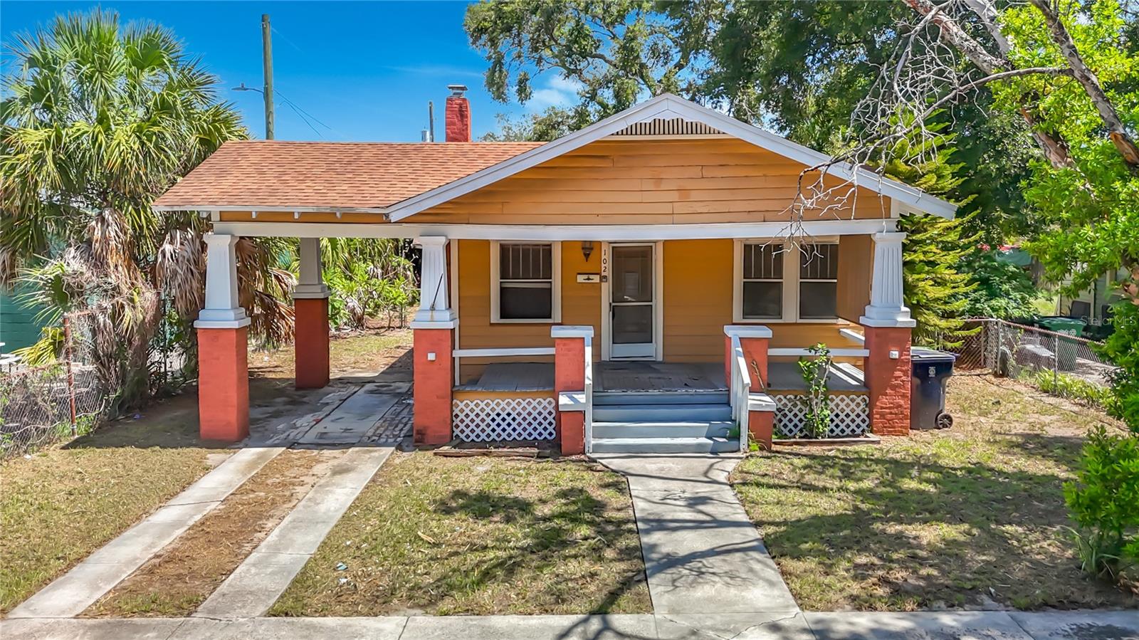 Bring your vision and creativity to this charming historic bungalow. Filled with original character, the home features beautiful wood floors, a classic fireplace, spacious living areas, high ceilings, and a welcoming front porch that captures the timeless appeal of Tampa's historic homes. Ready for renovation, this property offers an excellent opportunity for investors, renovators, or buyers looking to restore a vintage home to its full potential while adding their own personal style. The large backyard provides plenty of space for outdoor entertaining, gardening, or future improvements, and includes a detached storage building for added convenience. Ideally located just minutes from Downtown Tampa, Armature Works, the Tampa Riverwalk, Ybor City, Lowry Park Zoo, and Tampa International Airport, you'll also enjoy easy access to I-275, major hospitals, restaurants, breweries, shopping, and all that the vibrant Seminole Heights district has to offer. Whether you're searching for your next renovation project or a home with incredible potential in one of Tampa's most sought after neighborhoods, this is an opportunity you won't want to miss.