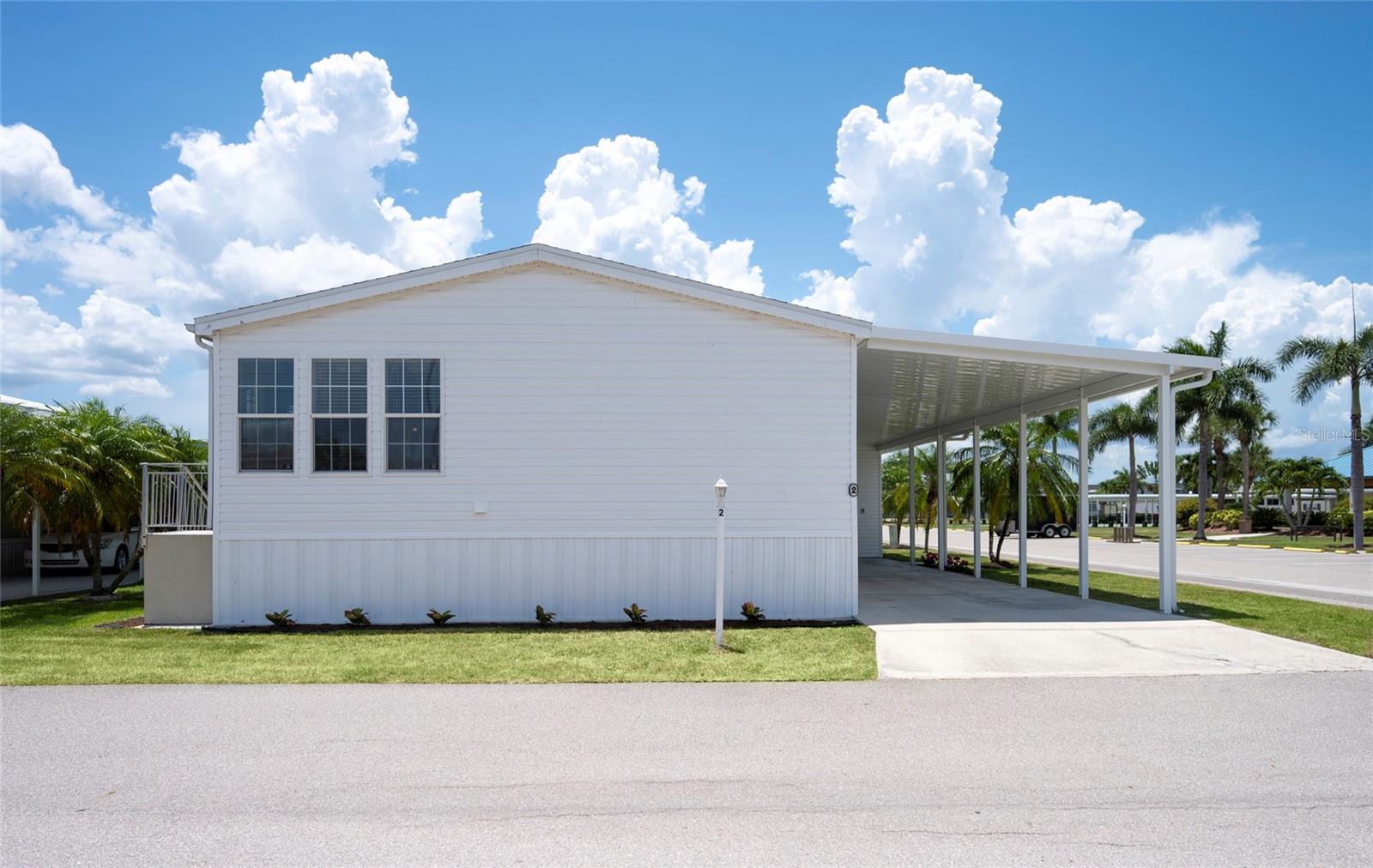 **Corner Lot Living in Windmill Village – One of Punta Gorda's Premier Waterfront 55+ Communities!**

Welcome home to this spacious **3-bedroom, 2-bath manufactured home** offering **nearly 1,400 square feet** of comfortable Florida living in the highly sought-after **Windmill Village** of Punta Gorda.

Perfectly situated on a desirable **corner lot**, this well-maintained home offers added privacy, excellent curb appeal, and is just a **short walk to the community pool and clubhouse**, making it easy to enjoy the incredible amenities and active lifestyle that Windmill Village is known for.

Inside, you'll find a bright, open floor plan with generous living spaces, a functional kitchen, and three spacious bedrooms—ideal for hosting family and friends or creating a home office or hobby room. The covered **carport** provides convenient parking, while the **storage shed** offers plenty of room for tools, golf clubs, fishing gear, and all your Florida essentials.

Life in Windmill Village is all about enjoying the waterfront lifestyle. This vibrant **resident-owned 55+ boating community** features marina access, boat slips (subject to availability), a heated pool, clubhouse, fitness center, pickleball, shuffleboard, social activities, and countless opportunities to meet neighbors and stay active. With easy access to Charlotte Harbor and the Gulf, it's a dream location for boaters, anglers, and anyone who loves Southwest Florida living.

Conveniently located near downtown Punta Gorda's waterfront parks, restaurants, shopping, golf courses, and medical facilities, this home offers the perfect blend of comfort, convenience, and community.

Whether you're looking for a year-round residence or the perfect seasonal retreat, this exceptional home is ready for you to start living the Florida lifestyle you've been dreaming of.