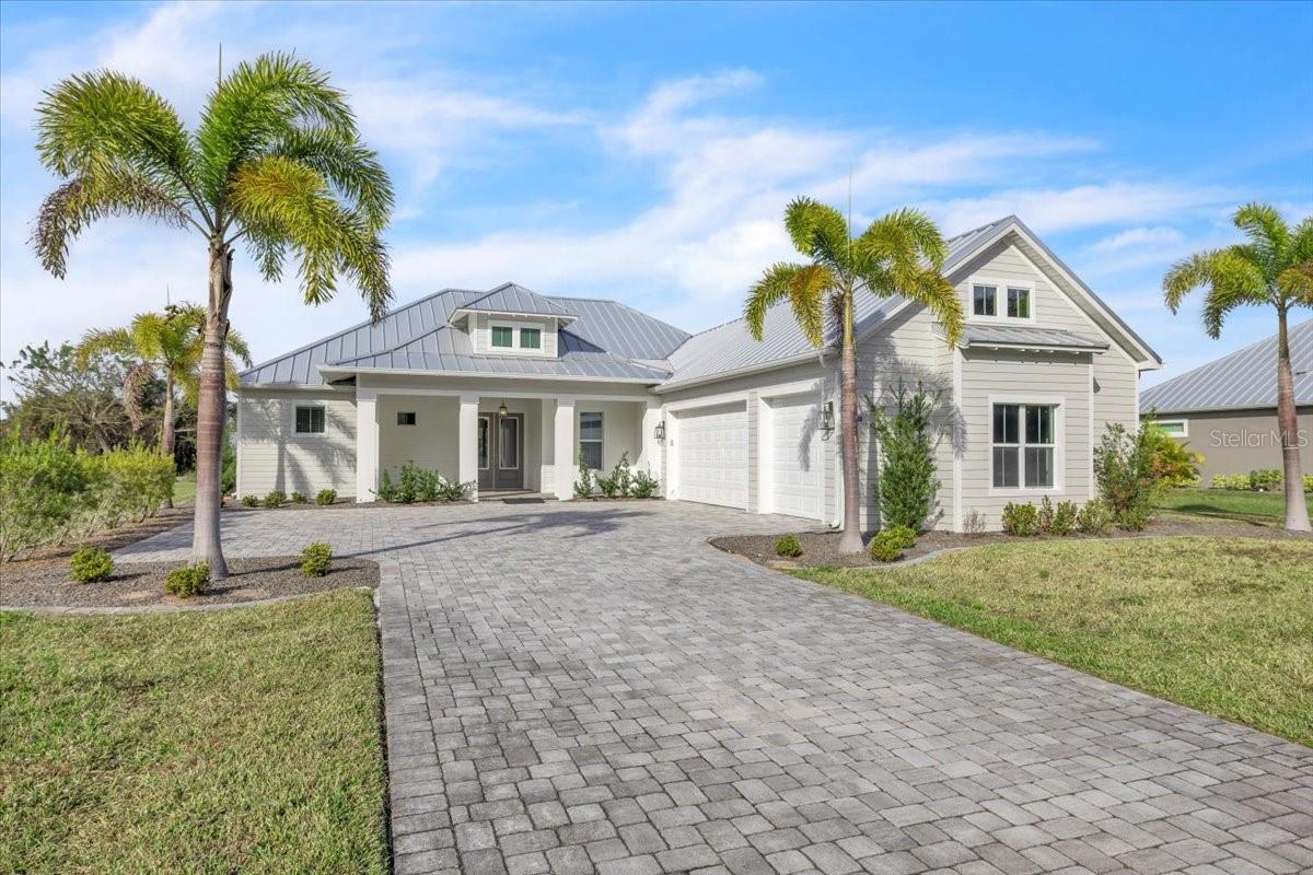 Virtually Staged. Experience elevated coastal-inspired living in this exquisite 3-bedroom, 3-bath residence nestled within the gated Estates on Peace River boasting WATERFRONT ACCESS. This neighborhood is where luxury, privacy, and waterfront access blend seamlessly. Enjoy an ASSIGNED BOAT SLIP, a private community boat launch, and tiki hut pavilion. This thoughtfully designed home with a modern neutral palette, the home welcomes you with soaring ceilings, crown molding, beautiful 8-foot single-panel doors, 5-inch baseboard trim, and a blend of LVP and 48 inch porcelain tile throughout. At the heart of the home, the designer kitchen impresses with its oversized island, quartz countertops accented by a stylish backsplash, premium stainless steel appliances, and solid wood soft-close cabinetry adorned with stylish hardware. Enjoy a private walk in butler’s pantry for added space and convenience. Whether entertaining or enjoying everyday living, this space is as inviting as it is refined. An added WHOLE-HOUSE REVERSE OSMOSIS SYSTEM enhances comfort and convenience throughout. The primary retreat is a serene sanctuary, offering generous space and a spa-like en-suite bathroom with an expansive frameless walk-in shower, dual vanities, and a spacious walk-in closet with custom-built cabinets and wood shelving. Two additional bedrooms and baths provide comfort and privacy for guests, while a spacious laundry room with cabinetry and storage adds everyday ease. Don't miss the additional DEN flex space, perfect for an office, play room, or entertainment zone. Step outside to the covered back patio and expansive backyard, set on an almost 1 acre lot, that invites outdoor living and future possibilities. Additional notable features include a NEW WELL AND PUMP SYSTEM (2024), impact windows, a tankless water heater, irrigation system, starlink satellite, and 25 gauge metal roof, further elevating the home’s value and peace of mind. The Estates on Peace River is a rare, master-planned enclave of 28.9+ acre parcels. Ideally positioned, this home offers convenient access to boating, fishing, and kayaking along the Peace River, with easy passage to Charlotte Harbor and the Gulf of Mexico. Nearby historic downtown Punta Gorda provides vibrant waterfront dining, easy access to the PG AIRPORT, boutique shopping, golf courses, parks, and marinas, while Southwest Florida’s renowned beaches, and cultural attractions are all within reach. This is luxury living close to the water—where tranquility, elegance, and an exceptional location come together beautifully. Don’t wait to make this one yours!