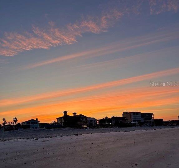 HUGE price improvement: A rare opportunity has arrived in Redington Shores: a direct Gulf-front property offering unparalleled potential for both luxury living and lucrative investment. For the first time in over 30 years, this prime piece of real estate is available to the market. Currently zoned as a condo with 2 separate raised units, the property has been cherished as a family vacation retreat, with both units totaling 2,750 sq. ft. of living space—each featuring 3 bedrooms and 2 bathrooms. The existing structure boasts a large parking pad, two one-car garages, and under-building storage, adding functionality to its enviable beachfront location. There is over 50 feet of Gulf frontage and a Sea Wall Already in place and the City provides a Beach scraper to keep the beach front view clean and free of debris. 

Another rare advantage: this property does not back up to Gulf Boulevard, providing a quieter, more private atmosphere with Constitution Park buffering the rear of the property, which has a dog walk, playground and town sponsored cookouts and events for residents. Just steps away, you’ll find the beach trolley, bus stops, local favorites like Candy Kitchen, Coco Wood Grill, Friendly Tavern, and Broke N Board, plus easy access to restaurants, coffee shops, and the famous Beach Pizza. The lot itself, just under a quarter acre (see attached survey), offers impressive development potential. Buyers are encouraged to call the Town Hall and ask for Eve, head of the building dept regarding set backs, zoning and what can be developed moving forward.  Currently zoned a condo.
All this, while being only 30 minutes to Tampa—home of the Buccaneers, Tampa Bay Lightning, the Rays, fine dining, international shopping, Broadway-caliber theater, and an international airport. Just minutes away, St. Pete offers a vibrant nightlife and its iconic new pier, while Clearwater Beach adds yet another world-class destination to the mix.
