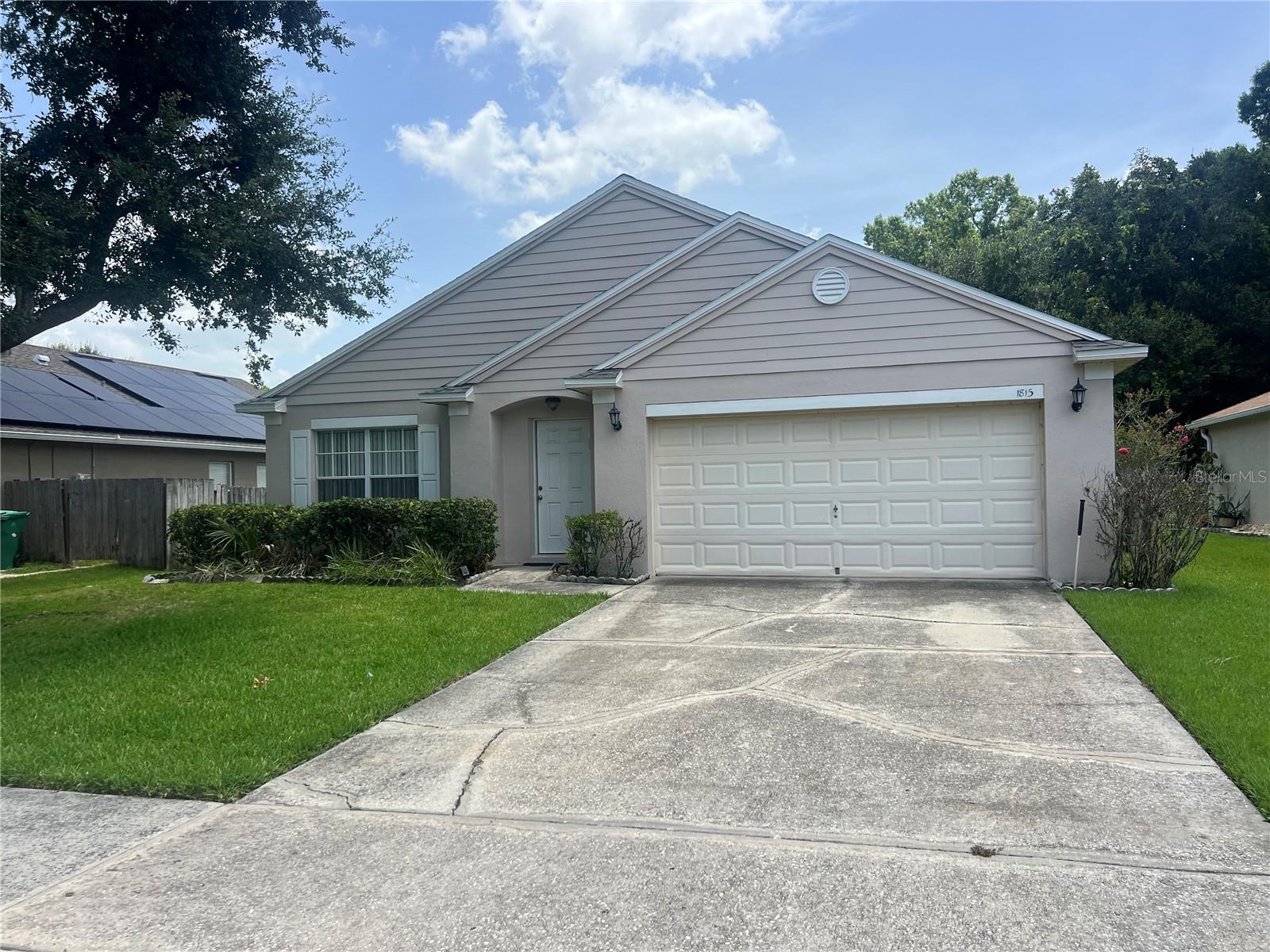 Welcome home to this beautiful 4-bedroom, 2-bathroom single-family residence located in the heart of Winter Garden! Spanning 2,199 square feet of living space, this home features a highly desirable split floor plan with soaring volume ceilings that create an open and airy atmosphere. The spacious layout includes a welcoming living area, laminate flooring in the bedrooms, and an attached 2-car garage. Step outside to your private, screened-in patio overlooking an expansive 8.125-square-foot lot, offering plenty of space for outdoor entertaining or relaxation. Nestled in a quiet neighborhood, this property offers unbeatable convenience. Enjoy fast access to SR 429, the Florida Turnpike, and charming historic downtown Winter Garden. Don't miss the opportunity to own a piece of this highly sought-after community—schedule your private tour today!