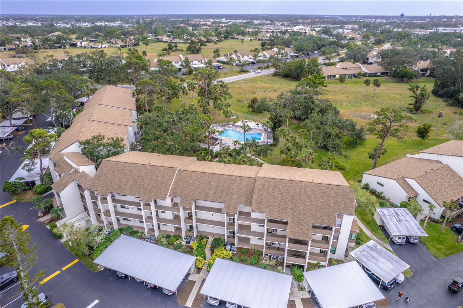 Welcome to Paradise at 832 Bird Bay Way and discover maintenance-free living in this updated **GROUND FLOOR CONDO** nestled in Bird Bay Village! This 2-bedroom 2 bath unit comes turnkey furnished and features luxury vinyl flooring throughout in an open-concept living space. The living room flows effortlessly to the serene views from your titled enclosed lanai, which opens up to a charming deck just steps away from Phase II pool, making it ideal for both everyday living and entertaining. The kitchen boasts granite countertops with stainless steel appliances and wood cabinetry. Both bathrooms have been updated with granite countertops; the guest bath features a tub with shower and primary bedroom with an en-suite bathroom has an updated tiled shower. AC unit installed in 2025.  This home's unbeatable location pairs perfectly with the amenity-rich community offering multiple pools, tennis and pickleball courts, a fitness center, library and clubhouse. Engage in a vibrant social activity, and events year-round. Bird Bay is adjacent to the Legacy Trail for biking and walking, just minutes from Historic Downtown Venice, and all the richness Venice offers. Whether you're seeking a seasonal retreat, forever home, or income-generating rental, this property delivers it all! Schedule your showing today and experience Venice coastal living at its finest!