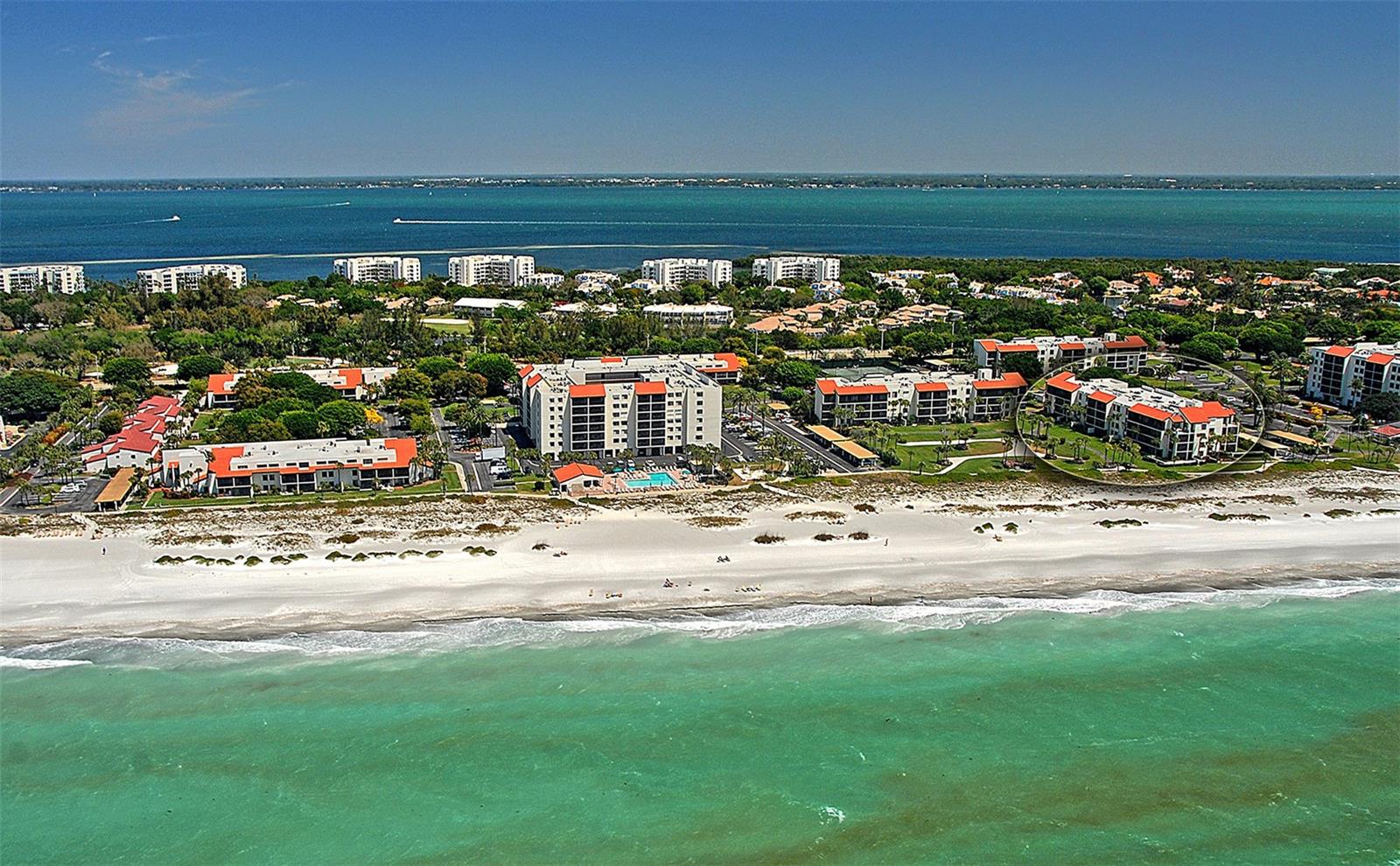 Experience coastal living at its finest in this beautifully updated ground-floor residence at Seaplace on Longboat Key. This 2-bedroom, 2.5-bath condominium in the desirable G5 building offers northwest Gulf views and stunning sunset skies from the screened lanai, just steps from the beach. The bright, open-concept floor plan features a sleek modern kitchen with glossy cabinetry, quartz countertops, stainless steel appliances, and a spacious breakfast bar perfect for entertaining. Floor-to-ceiling mirrors enhance the natural light and create a spacious, contemporary feel throughout the living and dining areas.

The primary suite offers a peaceful retreat with an updated en-suite bath, while the guest bedroom provides comfort and privacy for family and visitors. Hurricane-impact sliding glass doors and windows provide peace of mind and energy efficiency. Whether you are seeking a vacation getaway, seasonal retreat, investment property, or full-time residence, this move-in-ready condo checks every box.

Seaplace is a gated Gulf-front community situated on 42 beautifully landscaped acres spanning from the Gulf to the Bay. Residents enjoy resort-style amenities including 24-hour guard-gated security, a newly remodeled clubhouse, two heated swimming pools, kiddie pool, two hot tubs, three Har-Tru tennis courts, walking trails, fitness center, and private beach access with beach chairs and umbrellas provided. Conveniently located near the Longboat Key Club, St. Armands Circle, and Sarasota’s dining and cultural attractions. Schedule your private showing today and start enjoying the Longboat Key lifestyle!