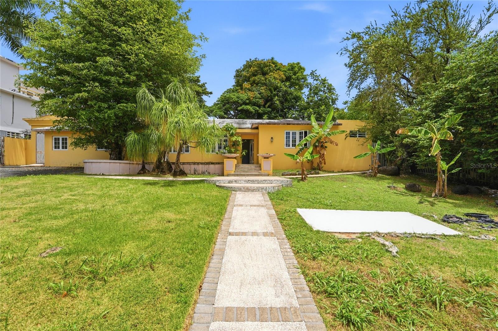 Located in Garden Hills Norte, this one-level residence has approximately 3,200 sq. ft. of living space on a 1,107.60 m² lot. The main house features 3 bedrooms, 3 bathrooms, and a double-car garage. The property also includes an accessory unit with 1 bedroom and 1 bathroom, ideal for use as a guest suite, home office, or additional living space. Property requires a complete renovation; it has great potential to become the property of your dreams in a prime location in Guaynabo.