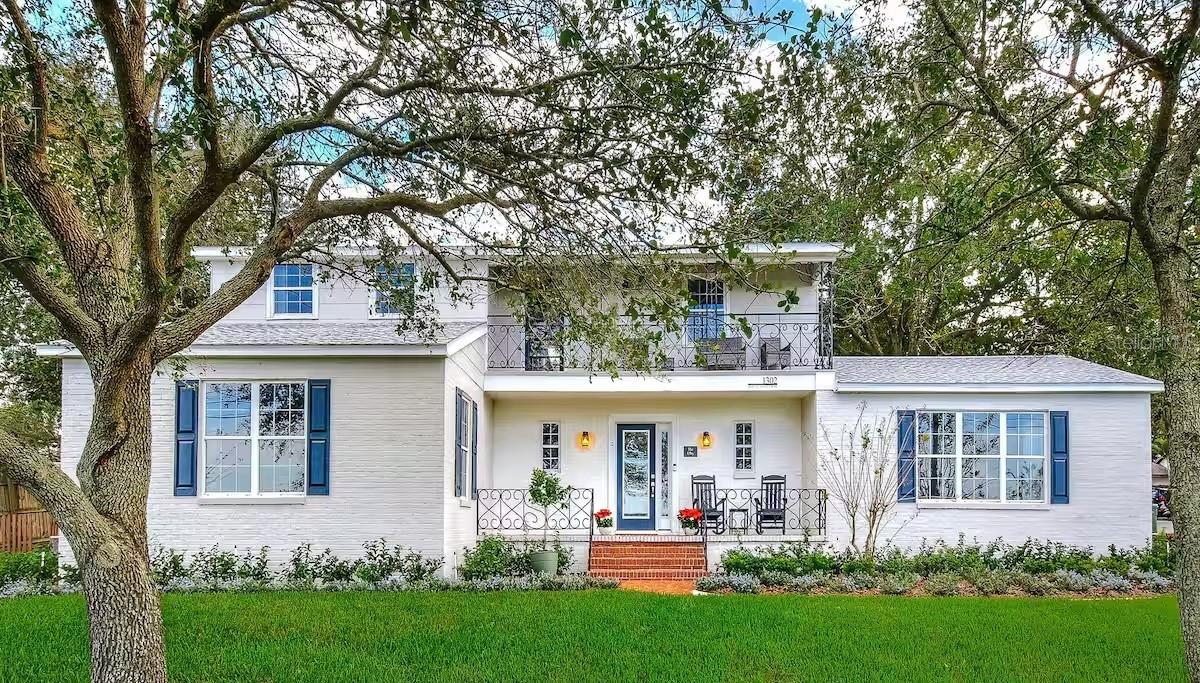 Come and See this Amazing Lake Front Home Located in the Water Skiing Capital of the World, on Lake Elbert in Winter Haven, FL. As you enter the front door of this beautiful Home the hardwood floors will delight your eyes as you look down the long foyer to the right that leads pass the kid's 2 Bedrooms area for them to enjoy, to a large Family room with Lake Views that will be one of your favorite places to relax. Going back down the foyer you will end up seeing the 1st floor Master King Ensuite with Lake views and a private bathroom on the left, and the Stunning Gourmet Kitchen on the right flowing into a light-filled Dining Sunroom with Lake Views, perfect for entertaining. This Home is the ideal home to Live in full time, or Enjoy it here during your favorite time of the year, or use it for a short term rental or longer term while you're at your other home. This Home easily sleeps 10 with it's 5 Bedroom, 4.5 Bathrooms, a kid's area that will sleep 4, while the Adults can appreciate 3 King Master Ensuites with their own Bathrooms. The kid's 2 bedrooms area with a bathroom circles back with a door into the Kitchen, the HUB of the home. You can go out the rear door to the nice patio and the 2 car Garage / Game Room that also has the Laundry Room and a Full Bathroom with a walk in Shower. Back inside, going up to the 2nd floor you have a door going out to the balcony in the front of the home over the 1st floor patio that allows for the peaceful Lake views. The other 2 Master King Ensuites with Walk in Closets and Private Full Bathrooms. Sitting on almost 1/2 acre on a hill up from the Lake, this AMAZING HOME with so much to love and could be Yours's to ENJOY all year or create a Great Cash Flow for your Retirement. It is only about a 10 minutes drive to LEGOLAND, and aproxamently 30 minutes or so to DISNEY WORLD, UNIVERSAL STUDIOS, SEA WORLD, and OTHER PARKS, and only about 1.5 hours to the BEAUTIFUL FLORIDA BEACHES OR EITHER SIDE OF THE STATE.  Come and See this Amazing Home the is Priced to SELL.