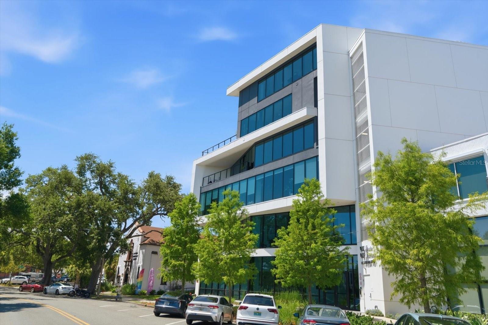 Rare opportunity! Come see this modern downtown St. Petersburg condominium nestled in front of the beautiful Mirror Lake! Built in 2020, this stylish 4th floor residence offers 2 bedrooms, 2 bathrooms, and 998 square feet of thoughtfully designed living space with high ceilings and tile flooring throughout. Secure fob access provides entry into the building and elevator access directly to your floor for added privacy and convenience.

The open-concept layout features a spacious living room with a large recessed entertainment center area, dedicated dining space, and an eat-in kitchen designed for both everyday living and entertaining. The kitchen is appointed with quartz countertops, stainless steel appliances, breakfast bar seating, pantry storage, and ample cabinetry. Sliding glass doors open to a private balcony overlooking the city skyline.

Both bedrooms include walk-in closets, while both bathrooms feature modern glass-enclosed showers. Additional highlights include a utility closet with stackable LG washer and dryer and one covered parking space.

Located in the heart of downtown St. Petersburg, this exceptional property is just steps from Mirror Lake and within walking distance to local shopping, dining, nightlife, parks, museums, and entertainment venues. Enjoy the perfect blend of modern design, security, convenience, and vibrant city living.