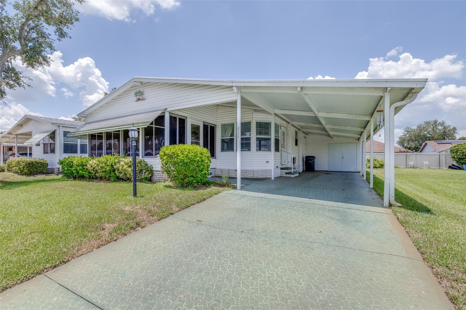 CUTE AND COZY 2 BR/2 BA HOME IN GARDEN GROVE OAKS 55+ COMMUNITY! This one-owner home is in one of Winter Haven's most sought-after 55+ communities where you own your land, and the HOA is low at $65/month. You will not be bored living here...activities include dances, birthday and anniversary celebrations, water aerobics, card games, shuffleboard, billiards and more. The community has its own clubhouse, pool and spa, and optional secured RV/boat parking. You will find 6235 Knotty Pine Dr on a quiet cul-de-sac with little traffic.  The bright, open, and spacious floor plan features 1080 sq ft of living area, plus a Florida room, perfect for your morning coffee, relaxing and entertaining.  Inside laundry room located in the hall bathroom. Notable upgrades include NEW ROOF in 2023, NEW A/C in 2025, and a FULL HOUSE GENERATOR. With some cosmetic updates, you can add your final touches to make this home yours!  The home will be pressure washed prior to closing. The community is clean, and pride of ownership is displayed throughout. Florida living at a price you can afford with no lot rent. Conveniently located just a few minutes from Hwy 27, shopping, medical facilities, and restaurants.Schedule your private viewing today!