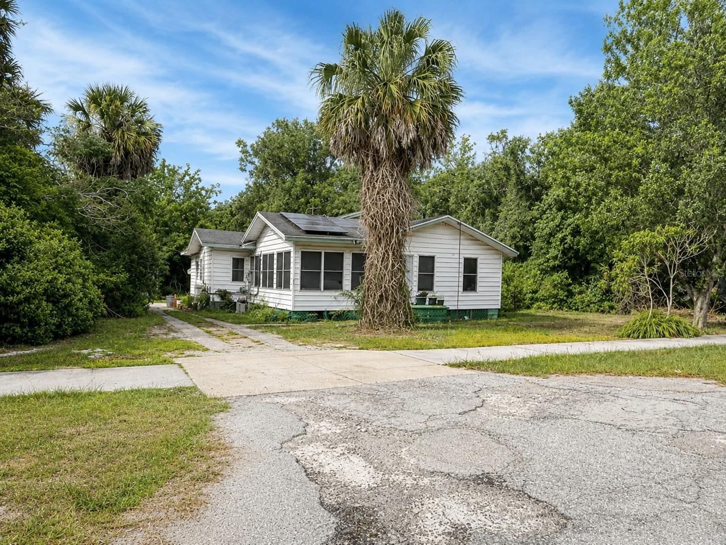 Auction Property. Spacious 1 Story home featuring 3 bedrooms and 2 baths is now being sold through the auction process. The home is located a few blocks away from Historic Downtown Eustis. The frame home is ready to be converted into your ideal living space or add it to your rental portfolio. The home sits on a half acres lot with a drive way leading to a shed. The home also features solar panels. DO NOT disturb the occupants. The home is being sold in as is condition.